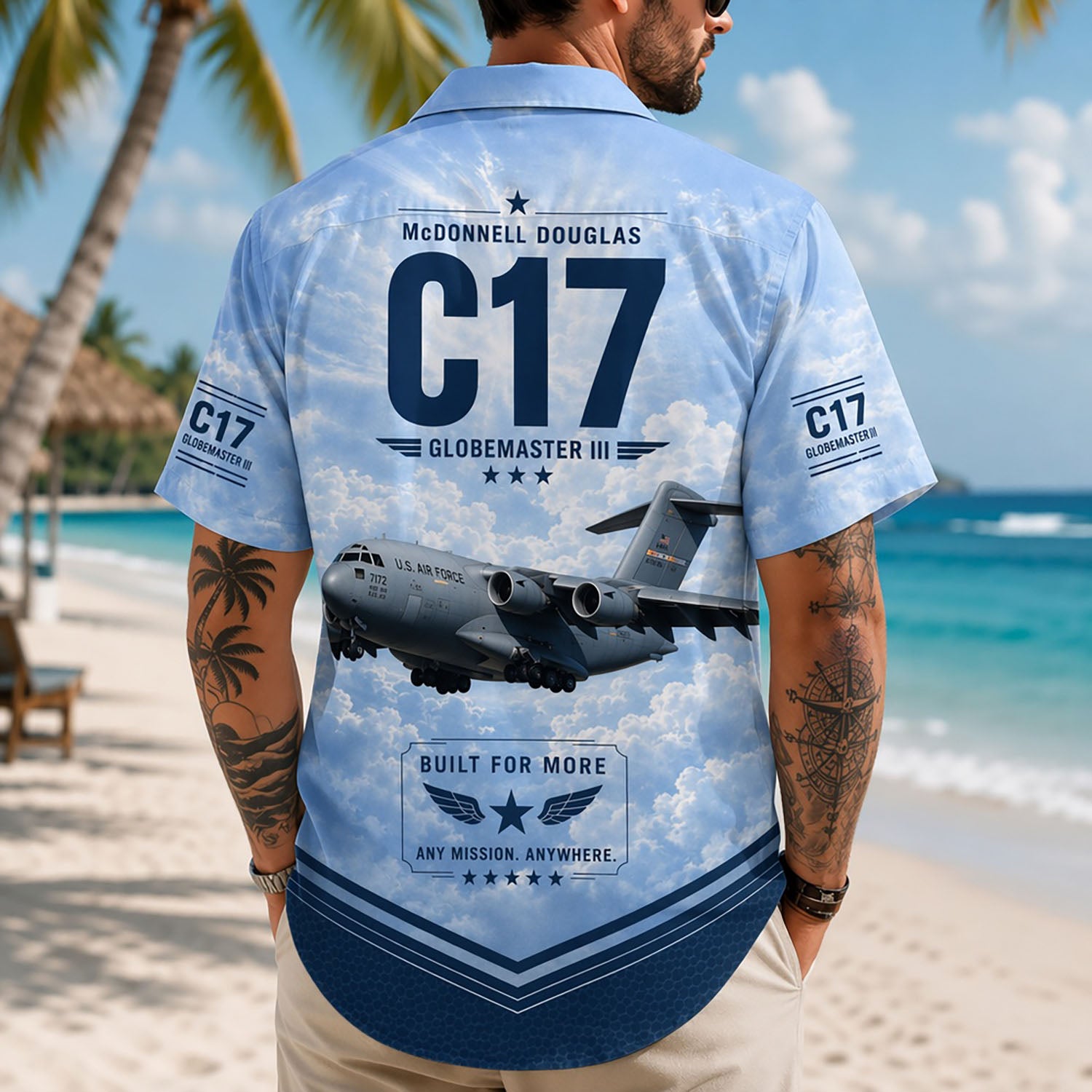Back view lifestyle of a man showcasing the detailed heavy-lift C-17 aircraft print, cloud background, and navy blue hem bands