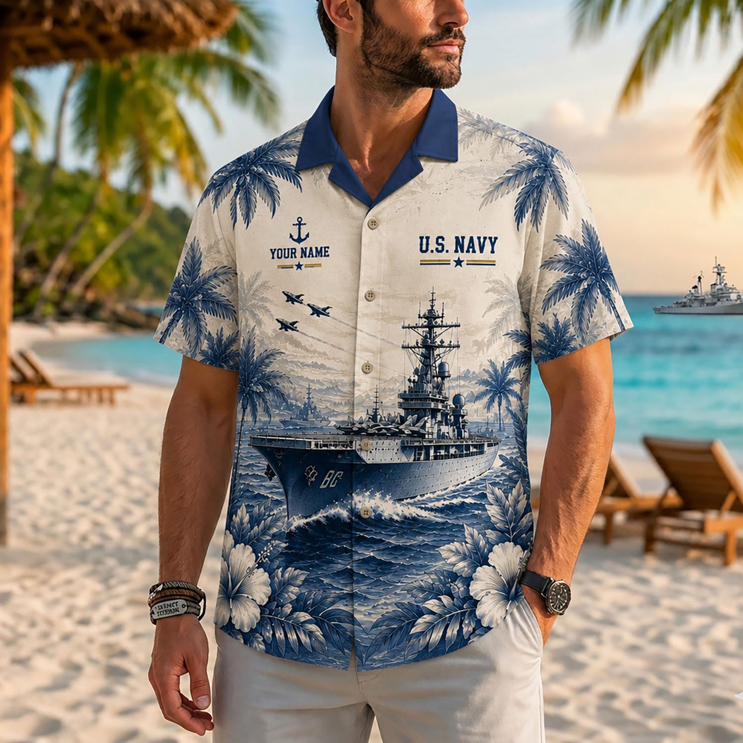 Close-up front view of a male model on a beach wearing the personalized cream USS Saratoga CV-60 shirt with navy collar accents