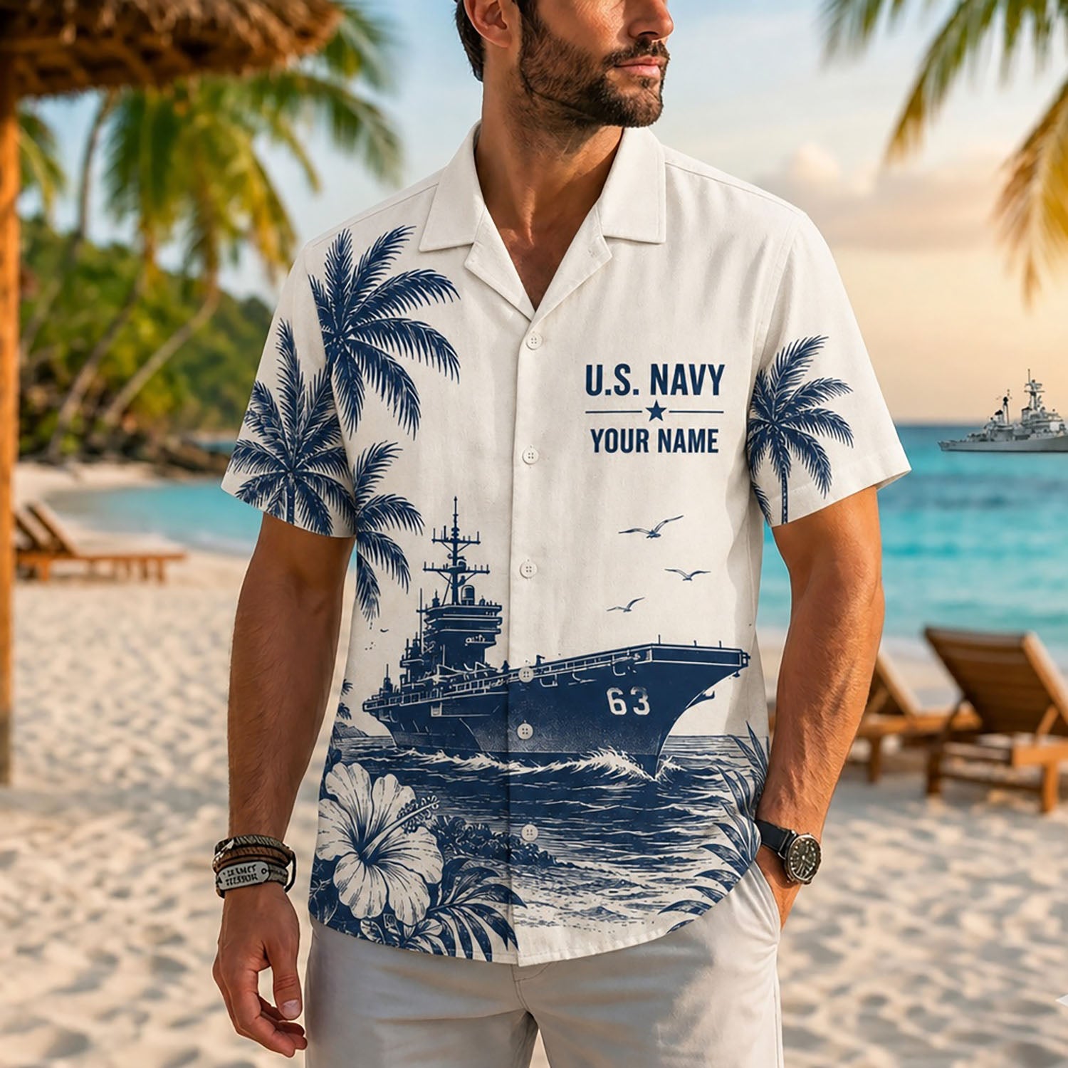 Close-up front view of a male model on a beach wearing the personalized cream USS Kitty Hawk CV-63 supercarrier resort shirt