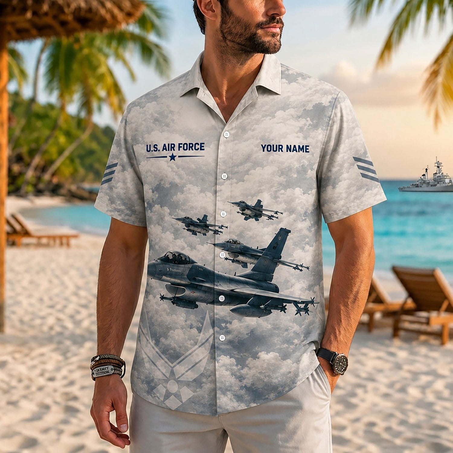 Close-up front lifestyle view of a man on a tropical beach resort wearing the personalized vintage grey F16 tactical jet shirt