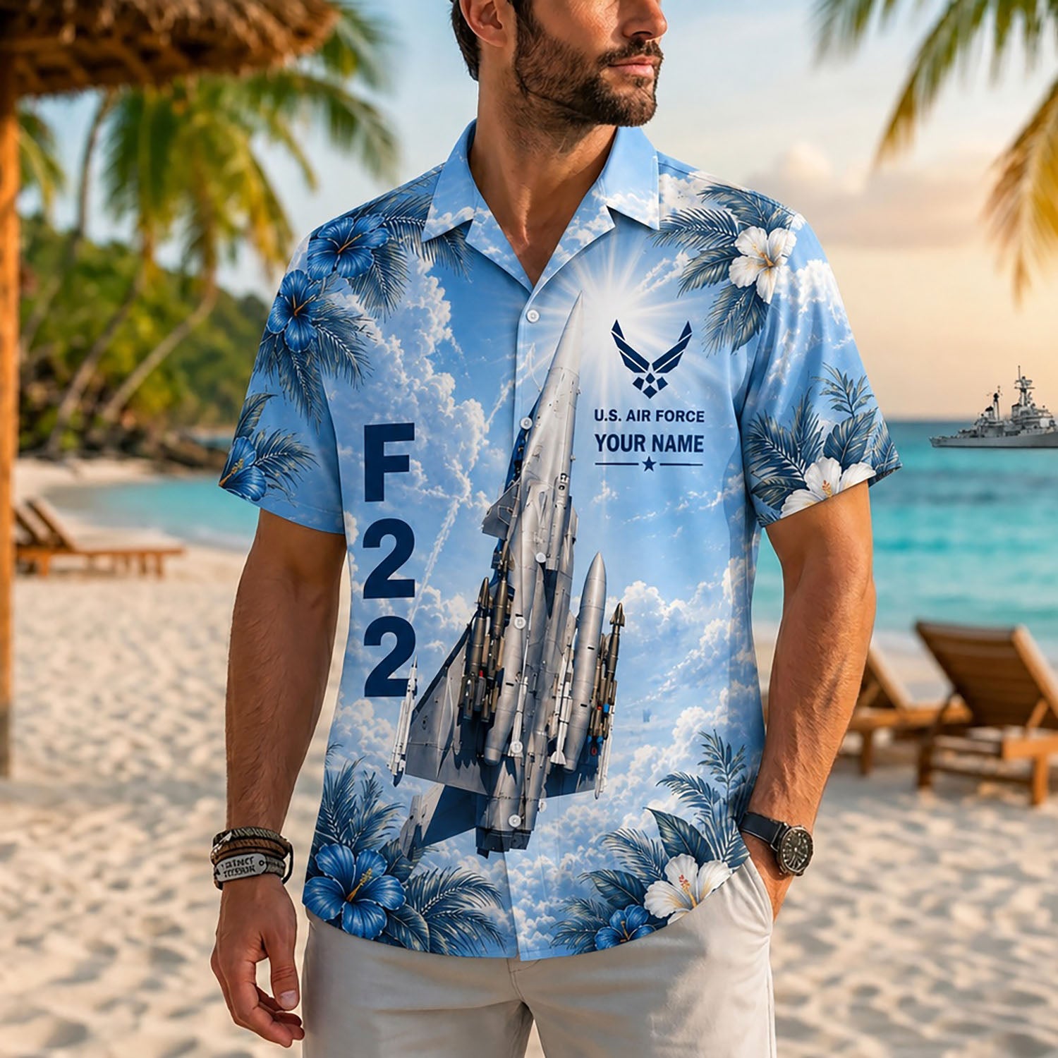 Close-up front lifestyle view of a male model on a tropical resort beach wearing the personalized F-22 Raptor fighter jet casual shirt