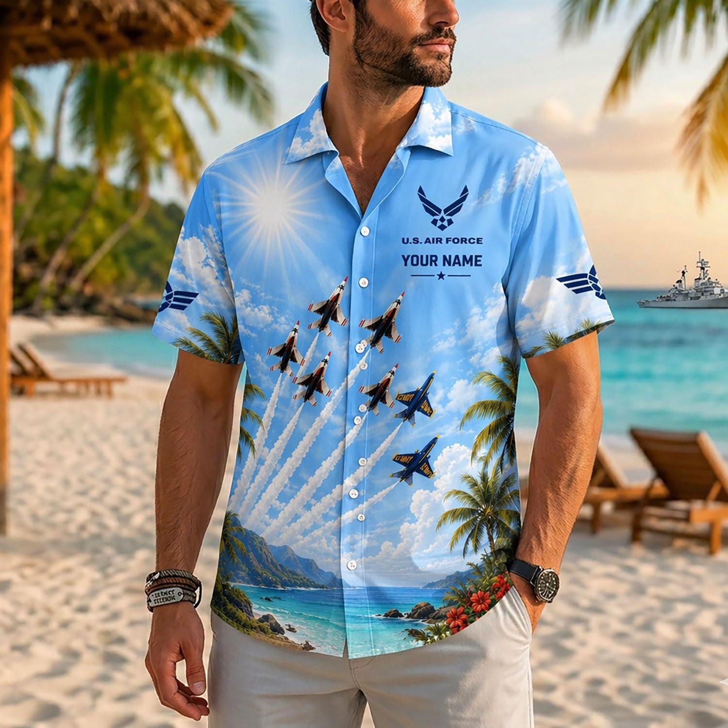 Close-up front lifestyle view of a man on a sunny beach resort wearing the personalized custom name fighter jet airshow tribute shirt