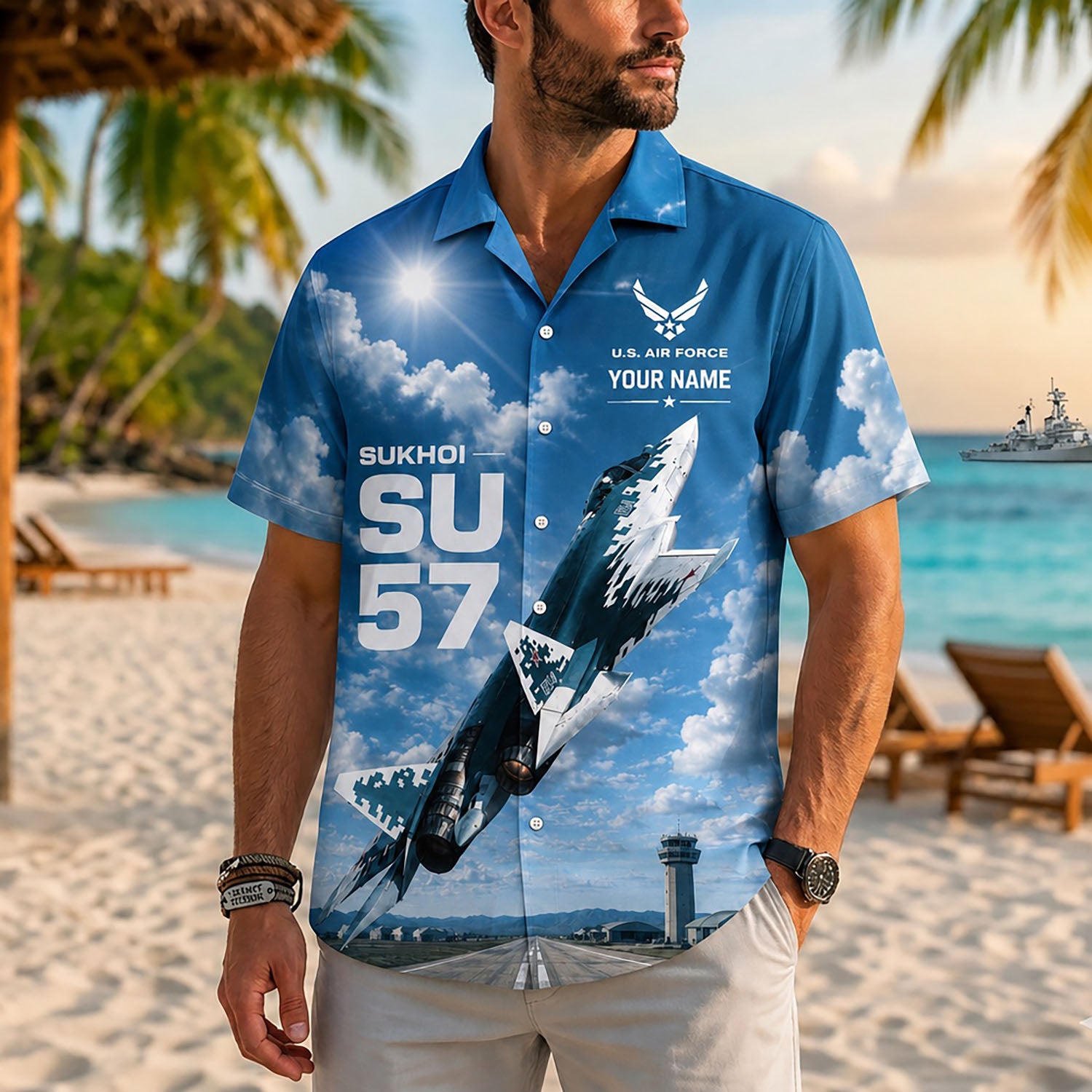 Close-up front view of a male model on a tropical coast beach wearing the personalized blue jet pilot veteran flight shirt