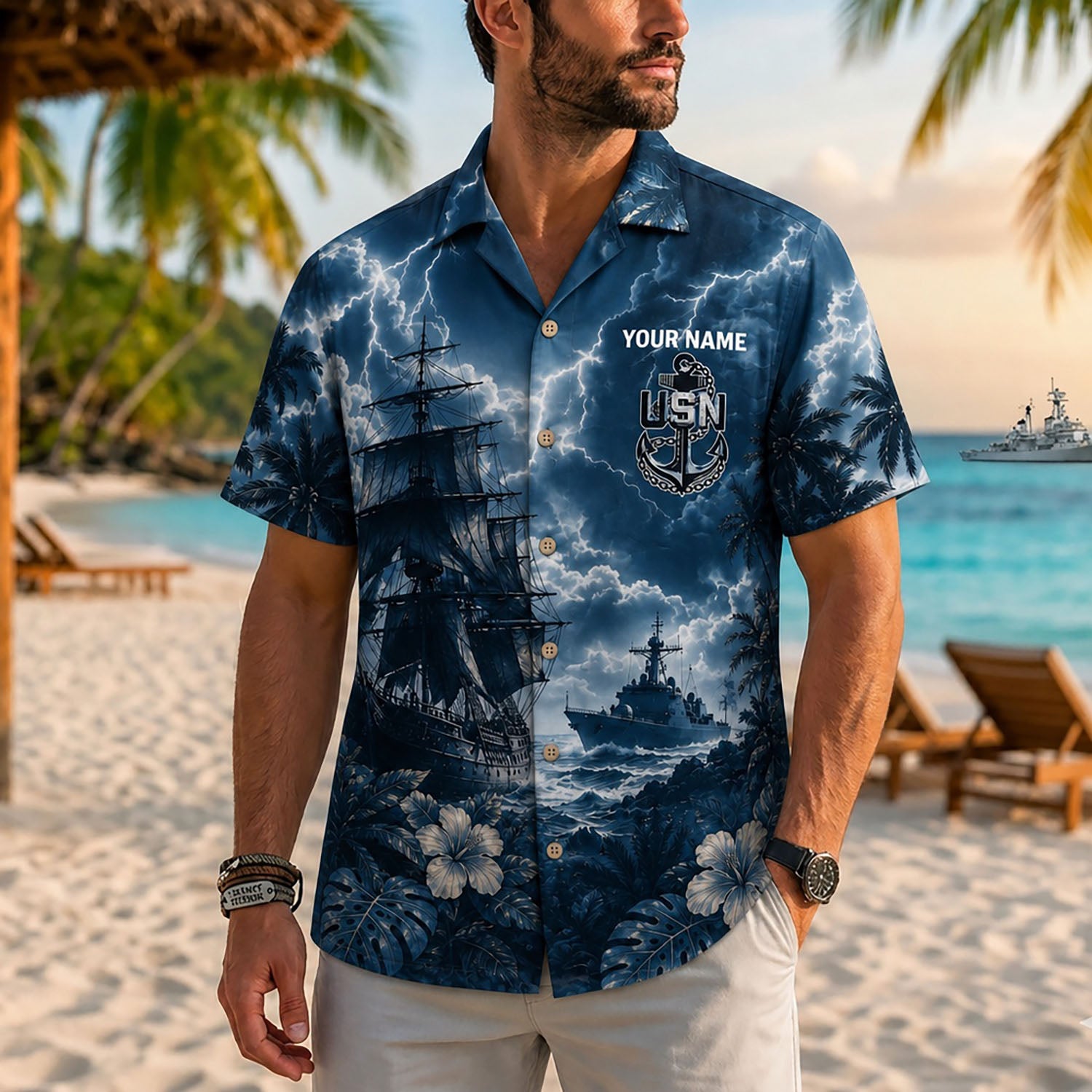 Close-up front view of a male model on a beach resort wearing the personalized deep navy blue lightning storm US Navy ship shirt