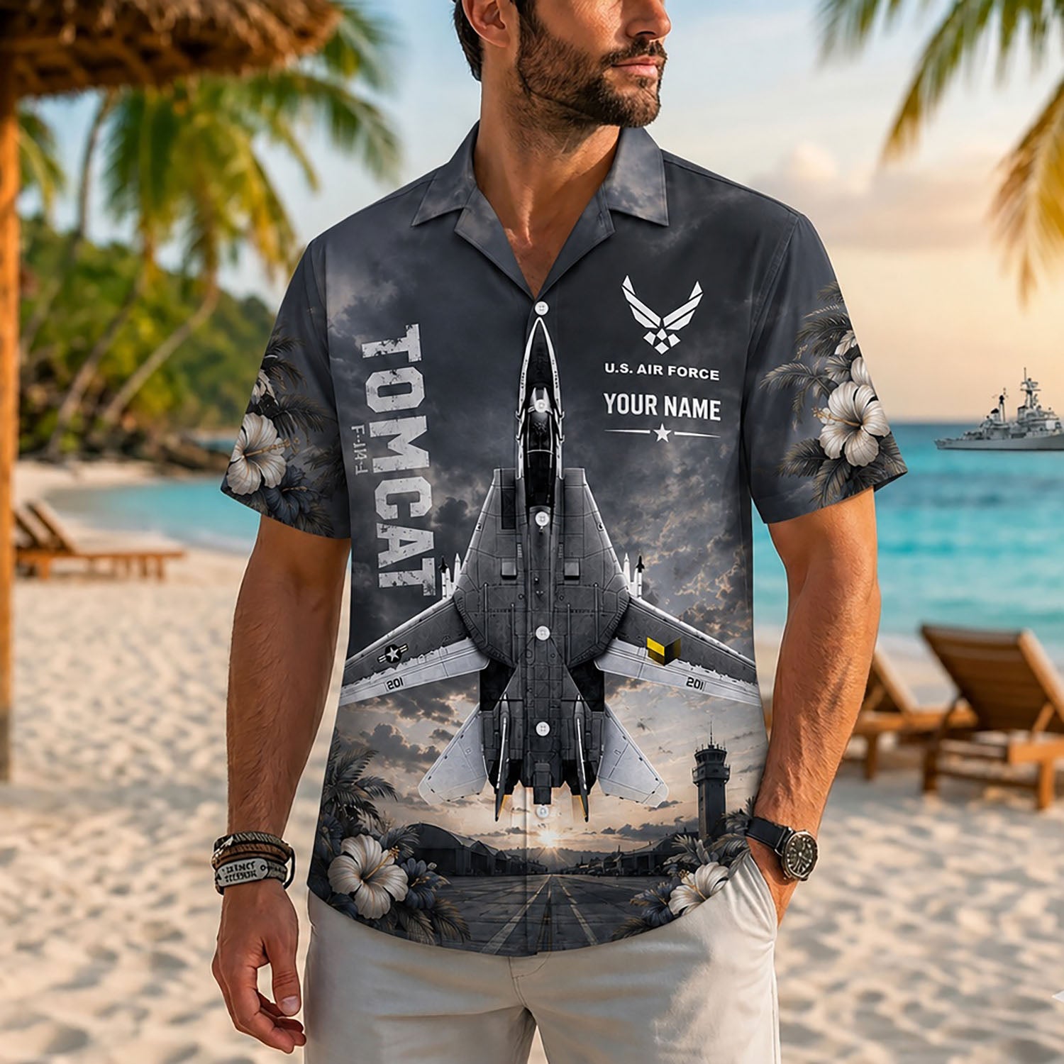 Close-up front lifestyle view of a man on a sunny resort beach modeling the custom name F-14 Tomcat retro aviation shirt