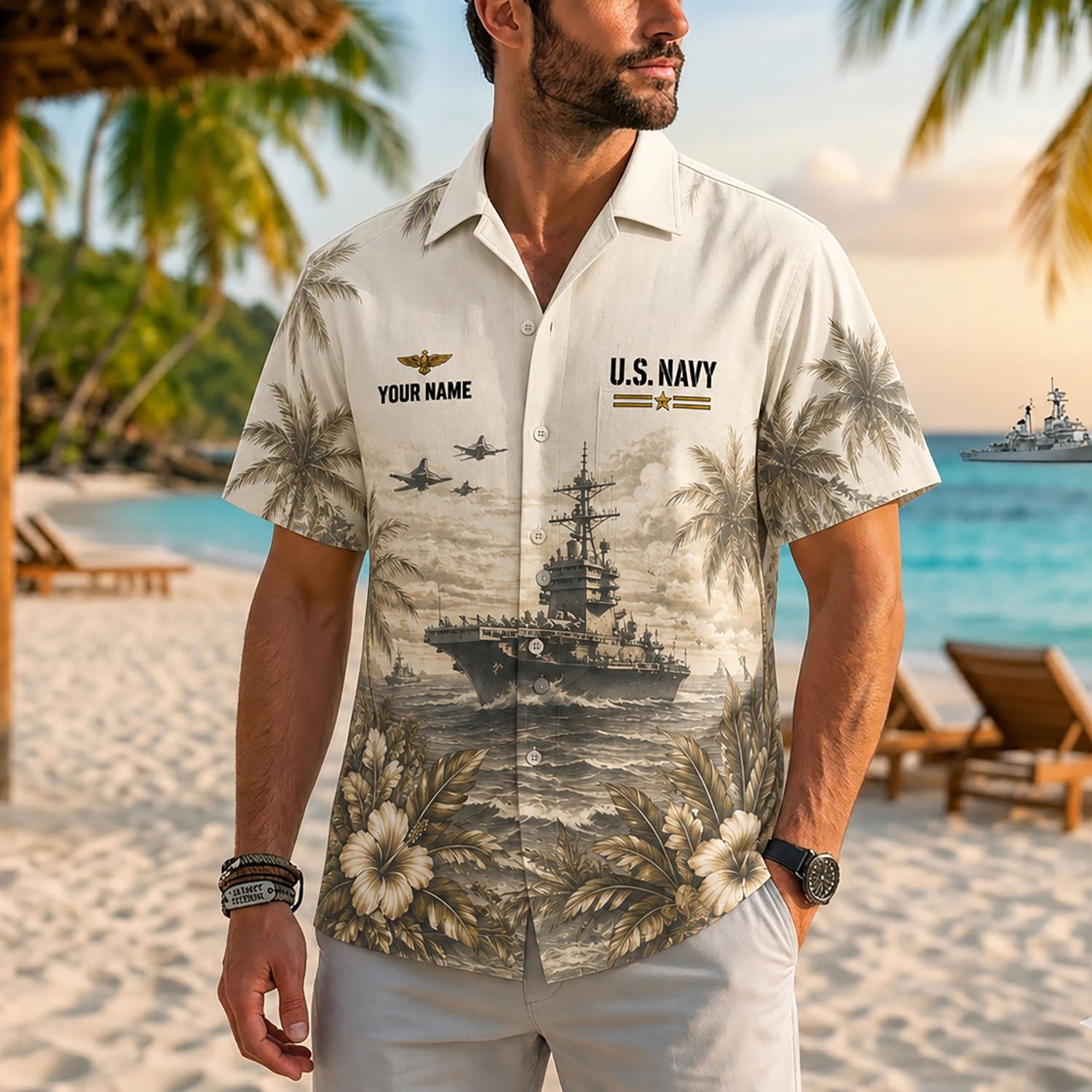 Close-up front view of a male model on a tropical beach wearing the personalized cream US Navy warship resort shirt