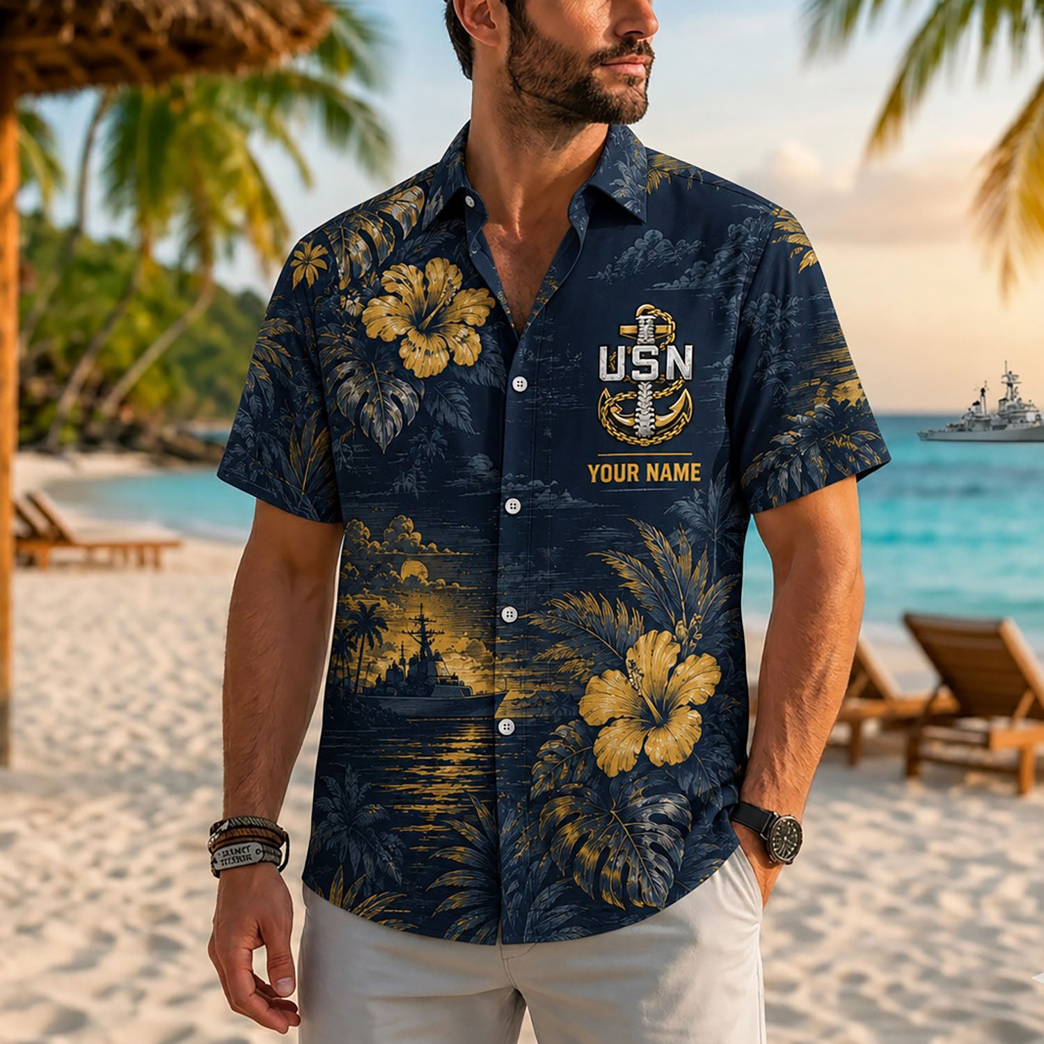 Close-up front view of a male model on a tropical beach wearing the personalized navy blue and gold US Navy Chiefs backbone shirt
