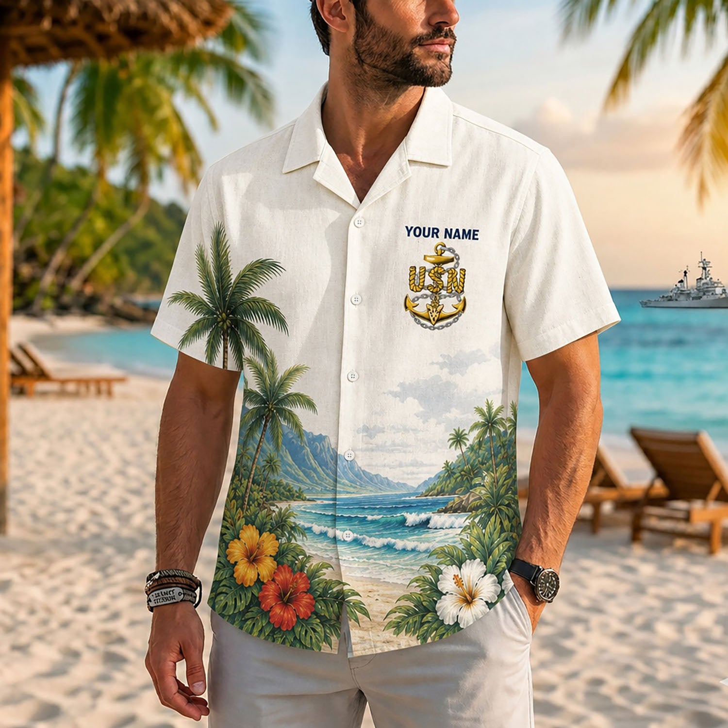 Close-up front view of a male model on a resort beach wearing the personalized cream-beige US Navy Chief Petty Officer shirt