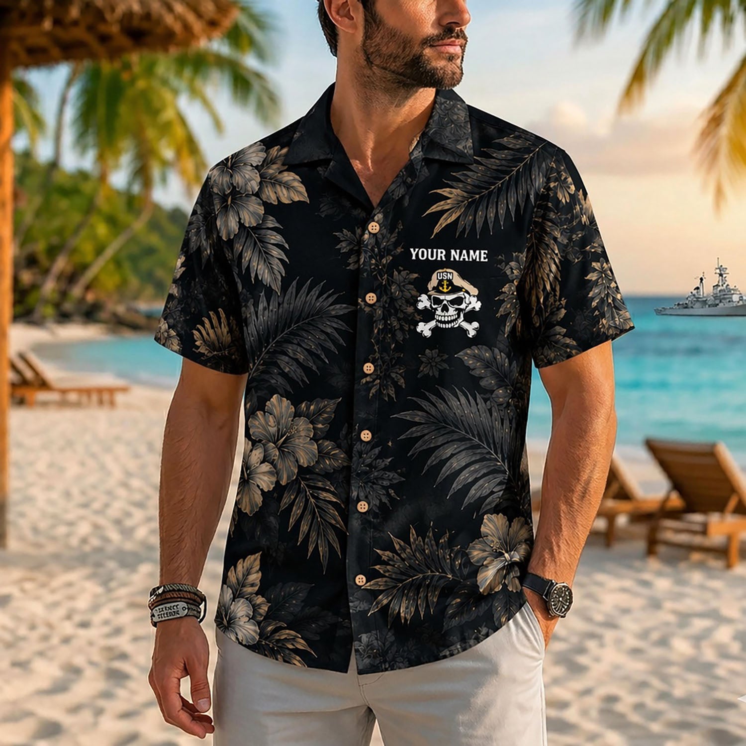 Close-up front view of a male model on a tropical beach wearing the personalized black and gold US Navy Master Chief skull shirt