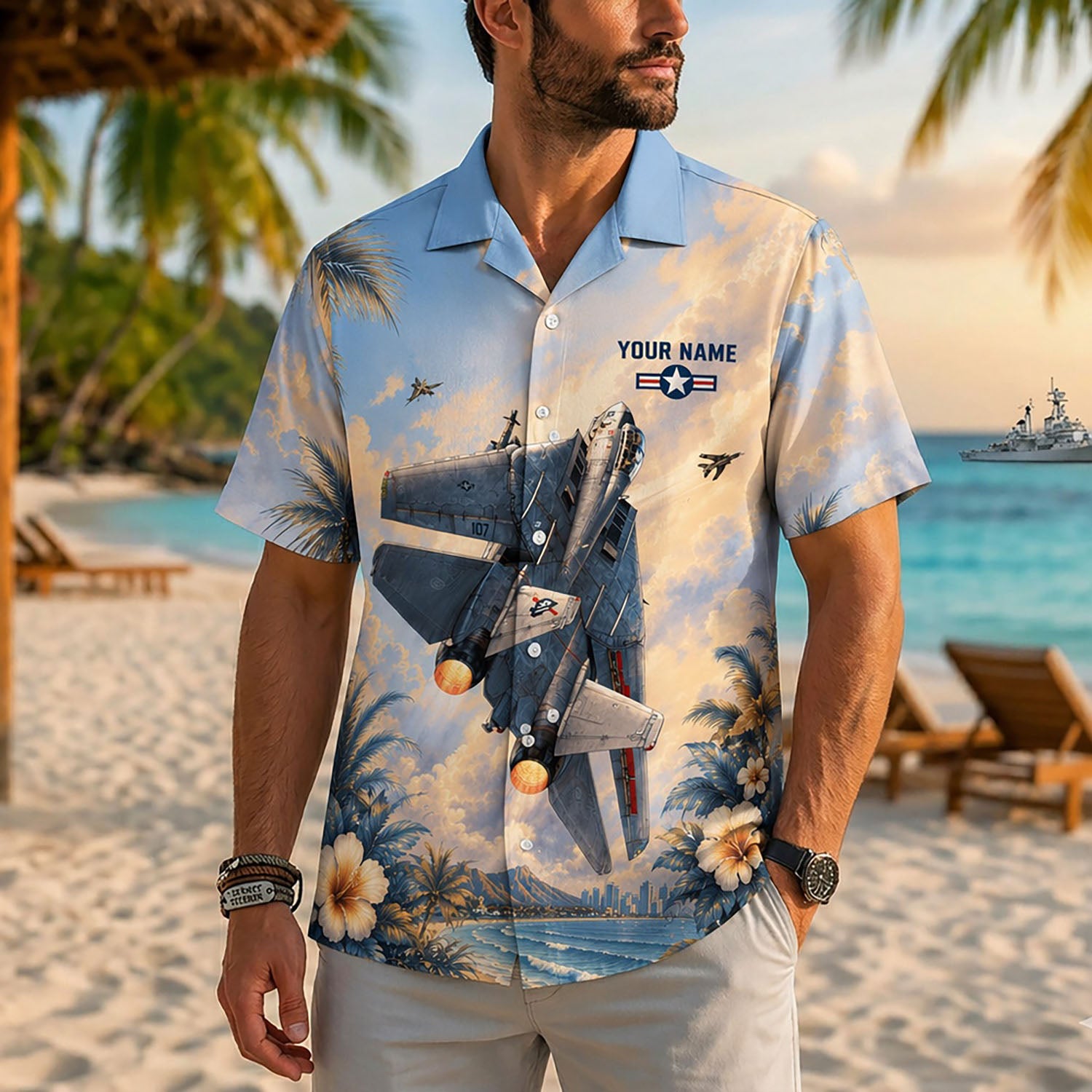 Close-up front view of a male model on a tropical resort beach wearing the custom F14 jet golden hour military shirt