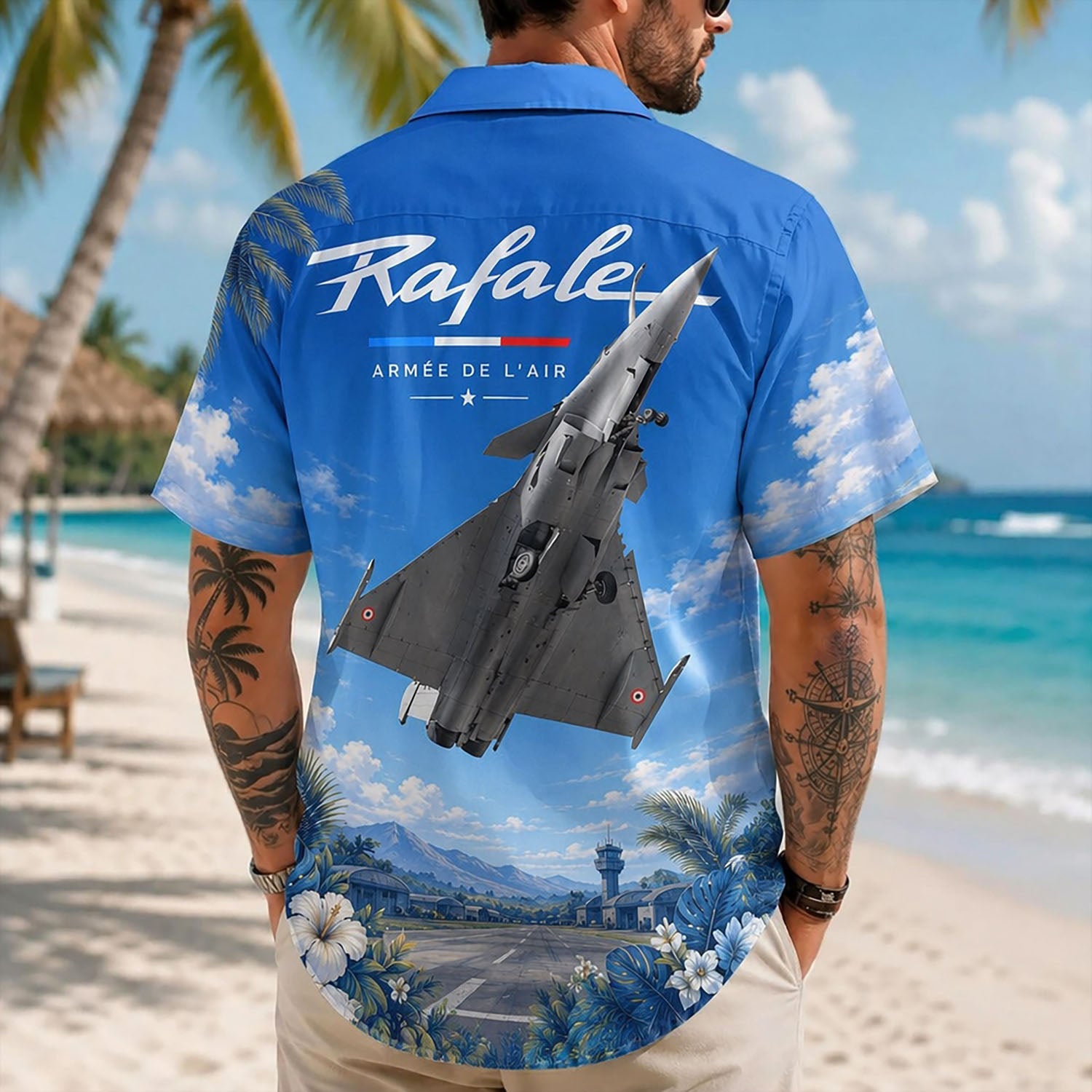 Back view lifestyle of a man showcasing the bold Rafale jet graphics and Armée de l'Air military insignia walking on sand