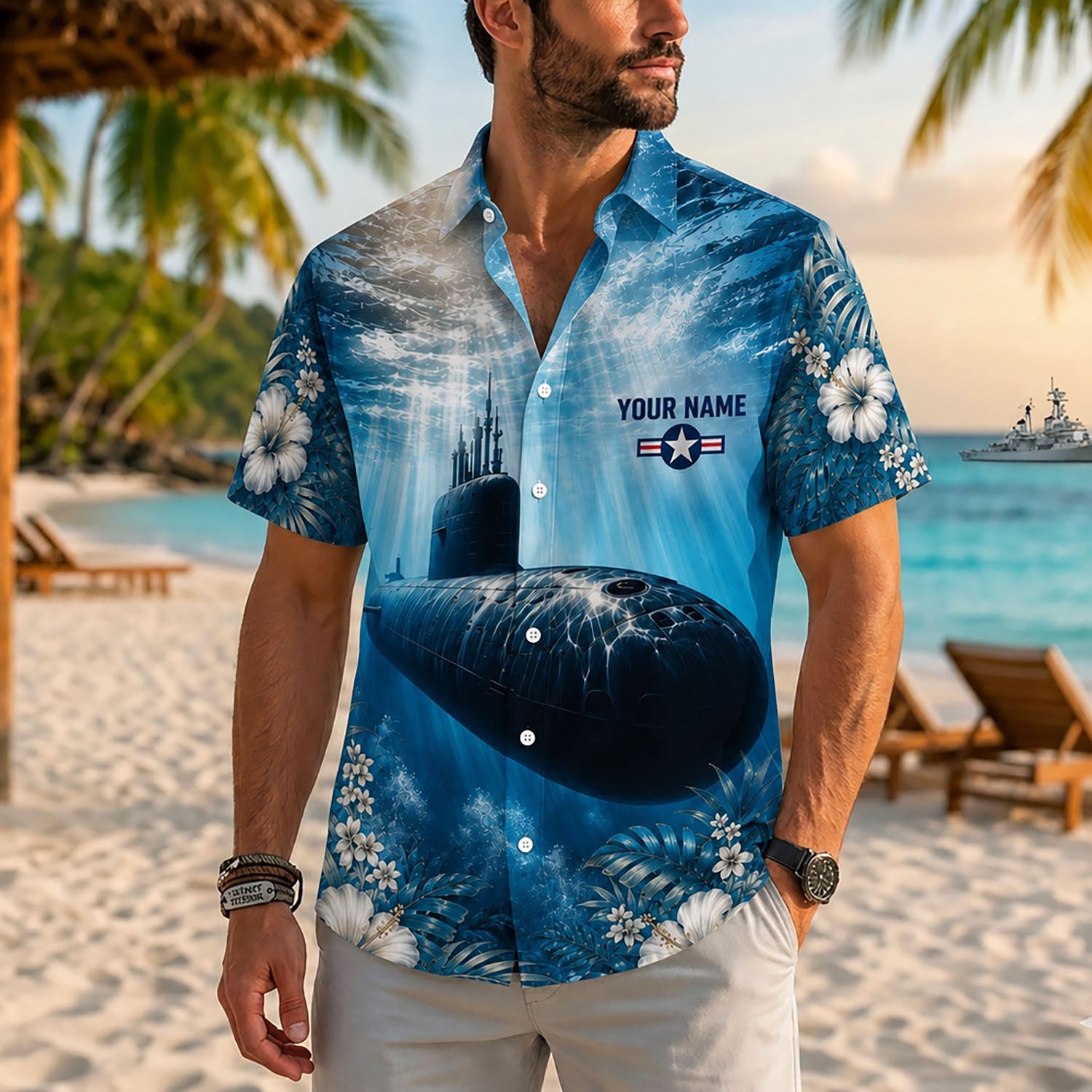 Close-up front view of a male model on a beach wearing the custom blue underwater submarine military Hawaiian shirt