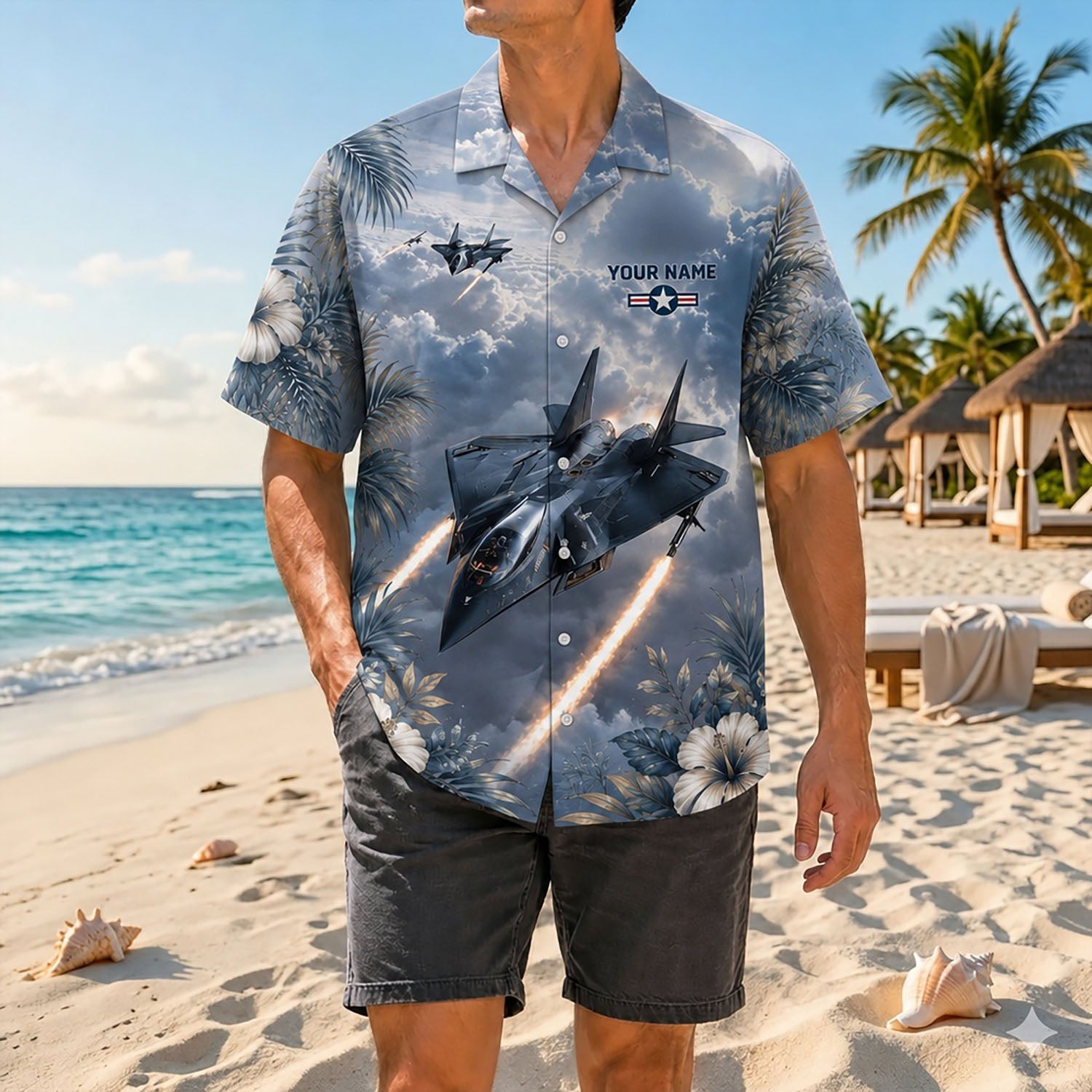 Full shot of a male model posing on a sandy beach wearing the custom cinematic Northrop Grumman F-14 Tomcat aviation shirt with dark shorts