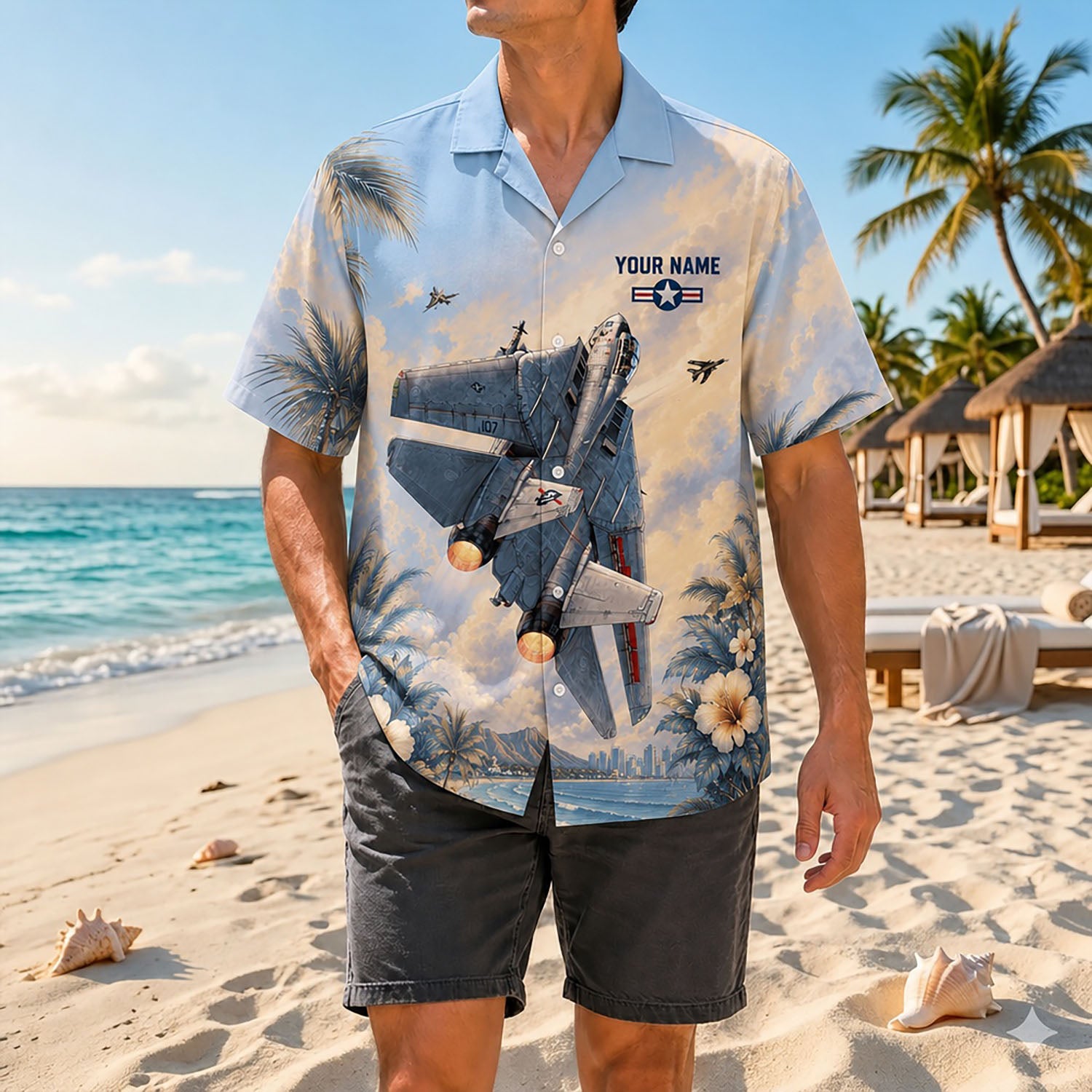 Full shot of a male model posing on a sunny beach wearing the custom sunset Northrop Grumman F-14 Tomcat aviation shirt with dark shorts