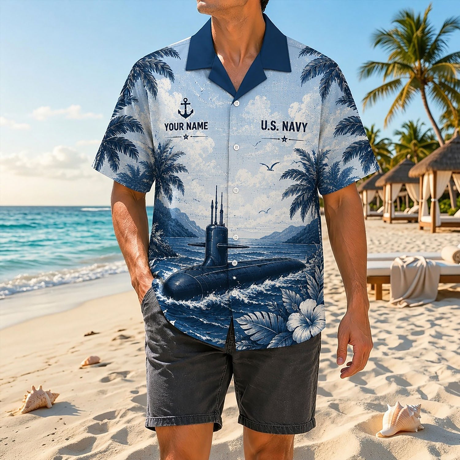 Full shot of a male model posing on a sunny shore wearing the personalized Royal Navy submarine tropical shirt with dark gray shorts