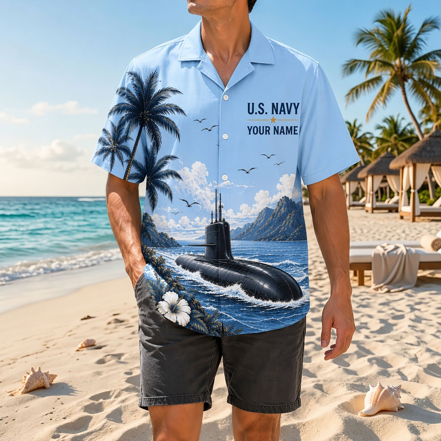Full shot of a male model posing on a sunny shore wearing the personalized US Navy submarine tropical shirt paired with dark gray shorts