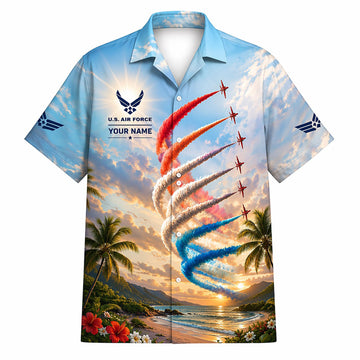 Front flat-lay view of the light blue USAF Hawaiian shirt featuring personalized name text, airforce crest, and jets pulling colored smoke trails over a tropical beach sunset