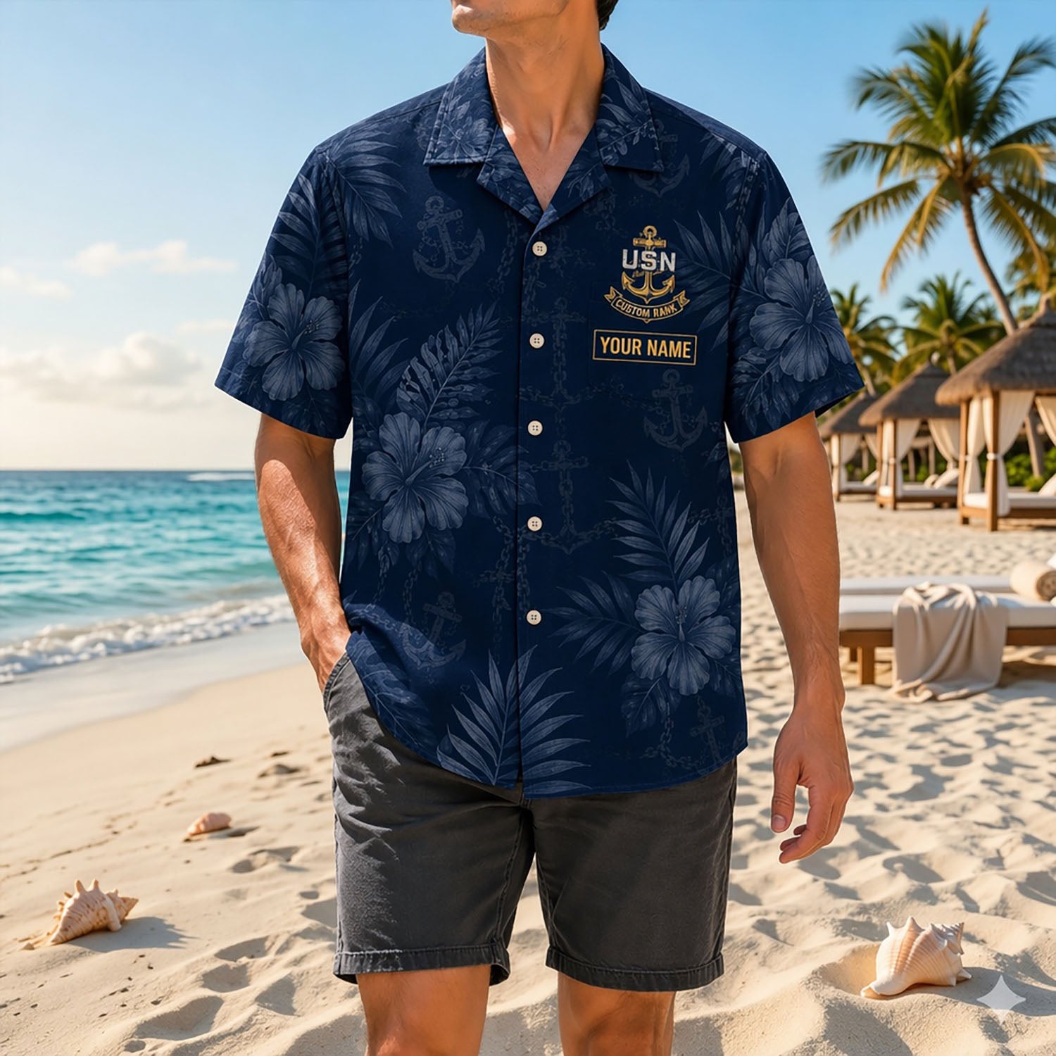 Full shot of a male model posing on a sunny shore wearing the custom US Navy Country Decision Hawaiian shirt with gray shorts