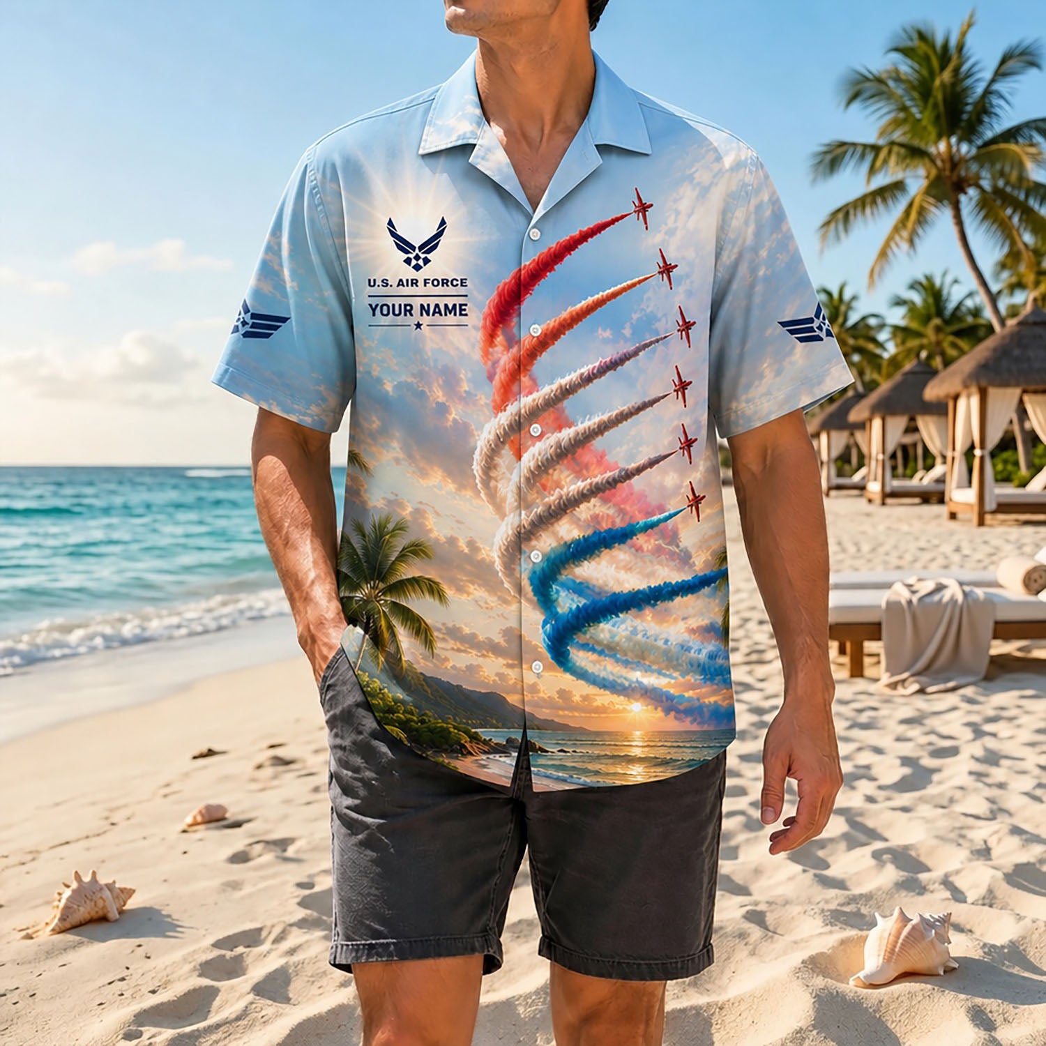 Full-body shot of a man modeling the custom patriotic airshow jet shirt on a tropical coast, styled with dark grey casual beach shorts