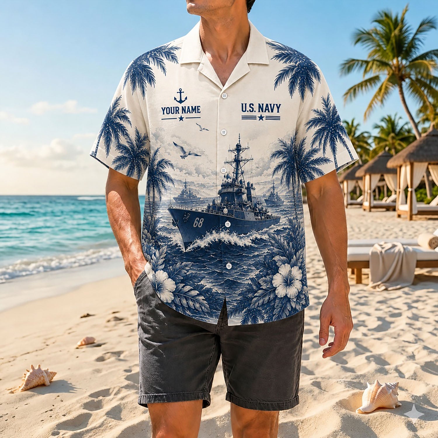 Full shot of a male model standing on sand wearing the custom name US Navy destroyer shirt paired with charcoal casual shorts