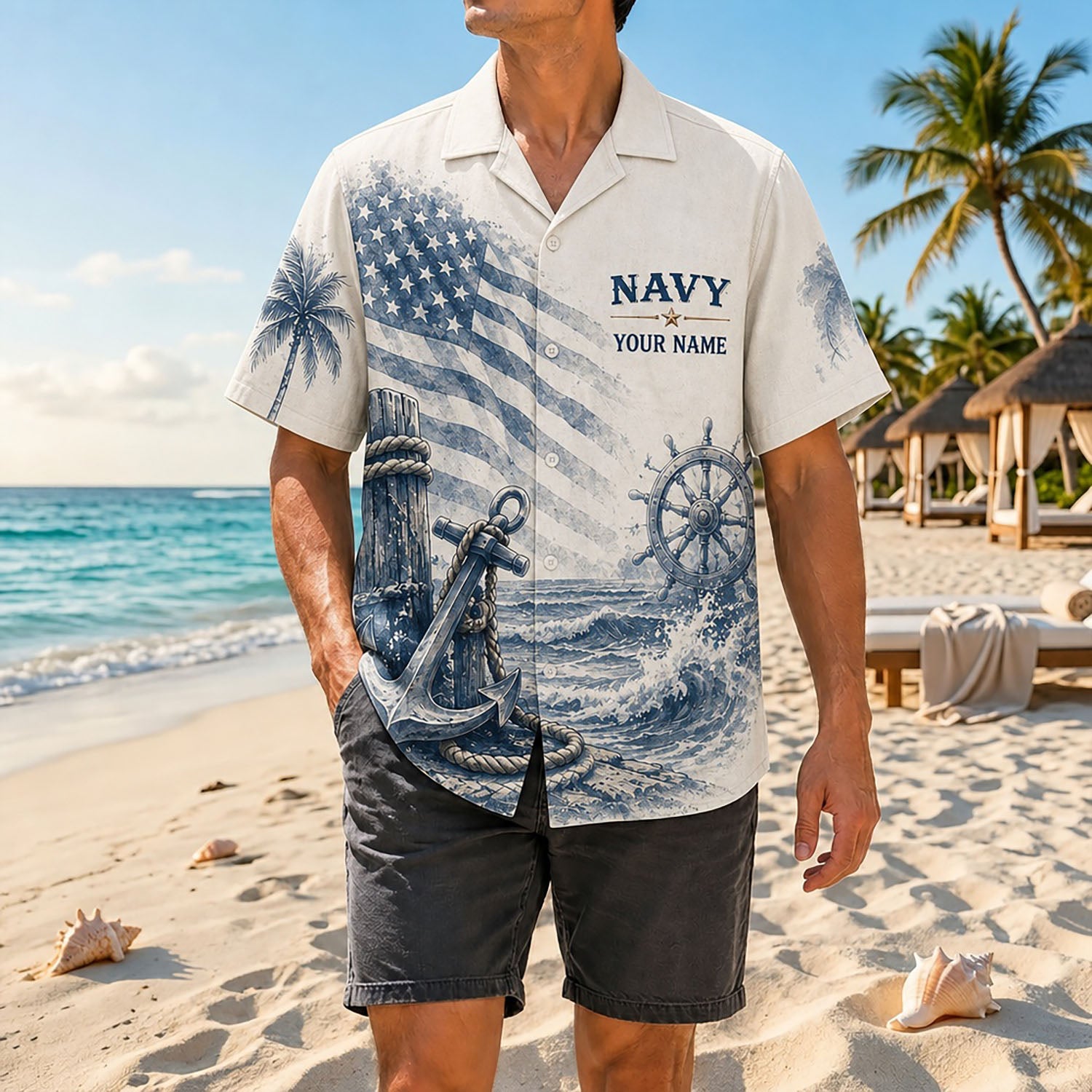Full shot of a male model standing on sand wearing the custom name US Navy 250th anniversary shirt paired with grey shorts