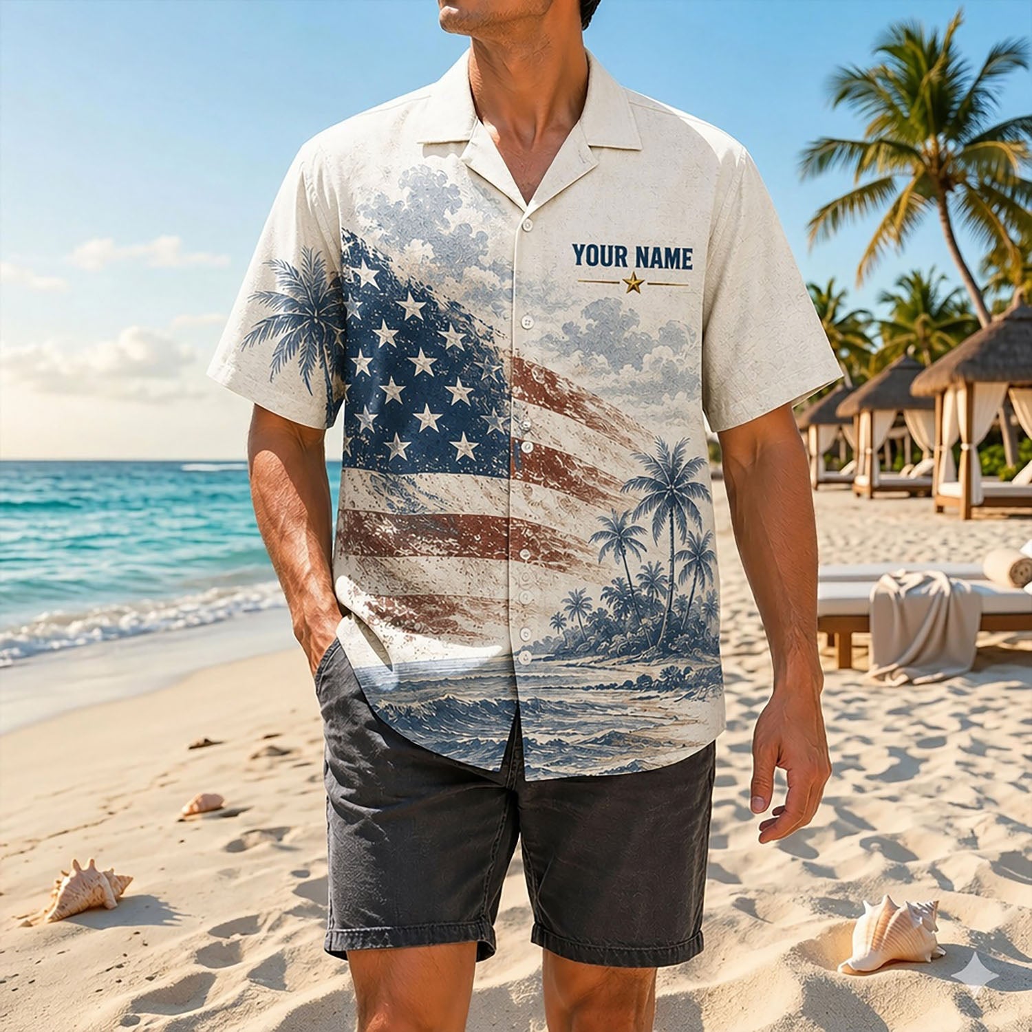 Full shot of a male model standing on ocean sand wearing the custom name USN veteran anchor shirt paired with dark grey shorts