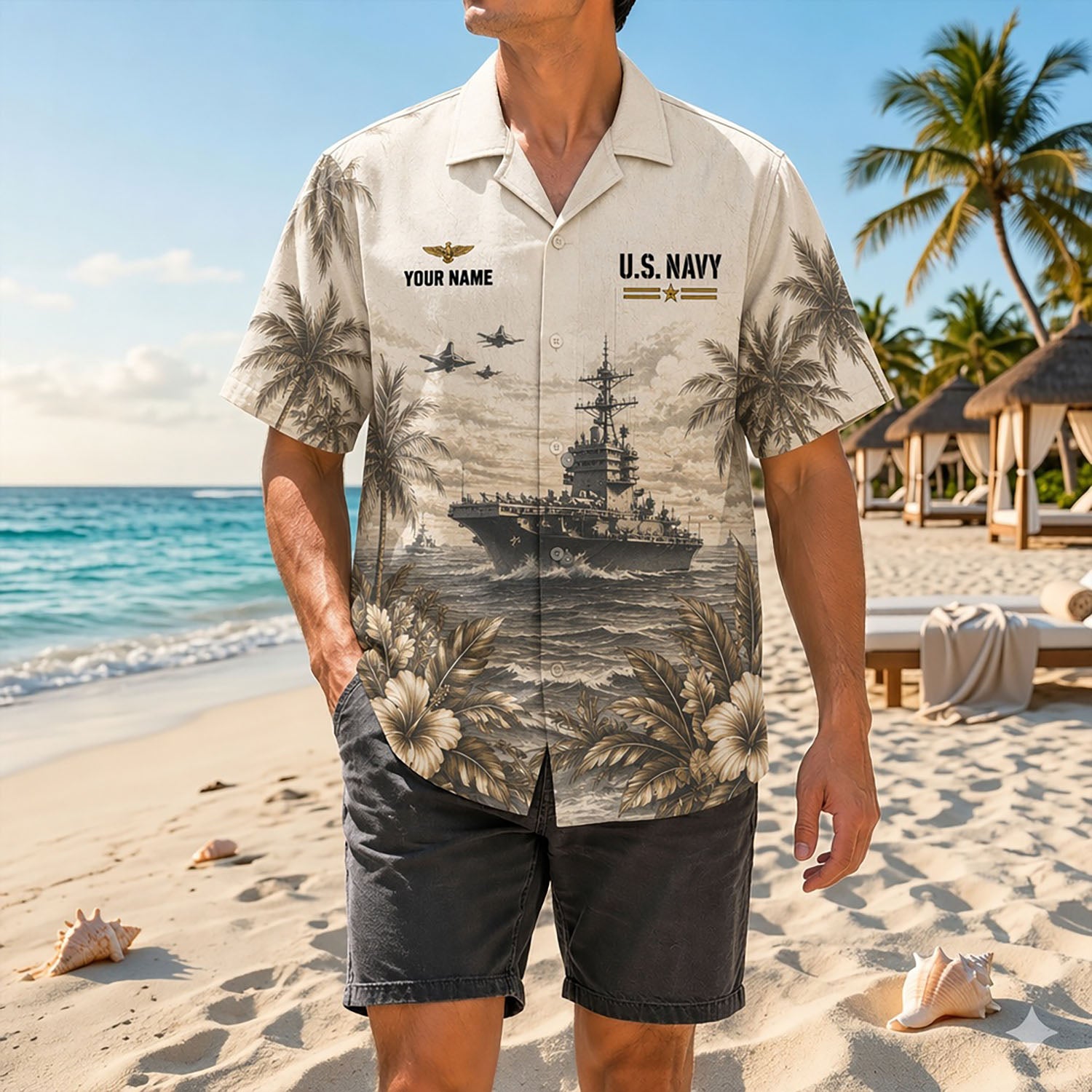 Full shot of a male model standing on sand wearing the custom name US Navy eagle anchor shirt paired with casual dark shorts