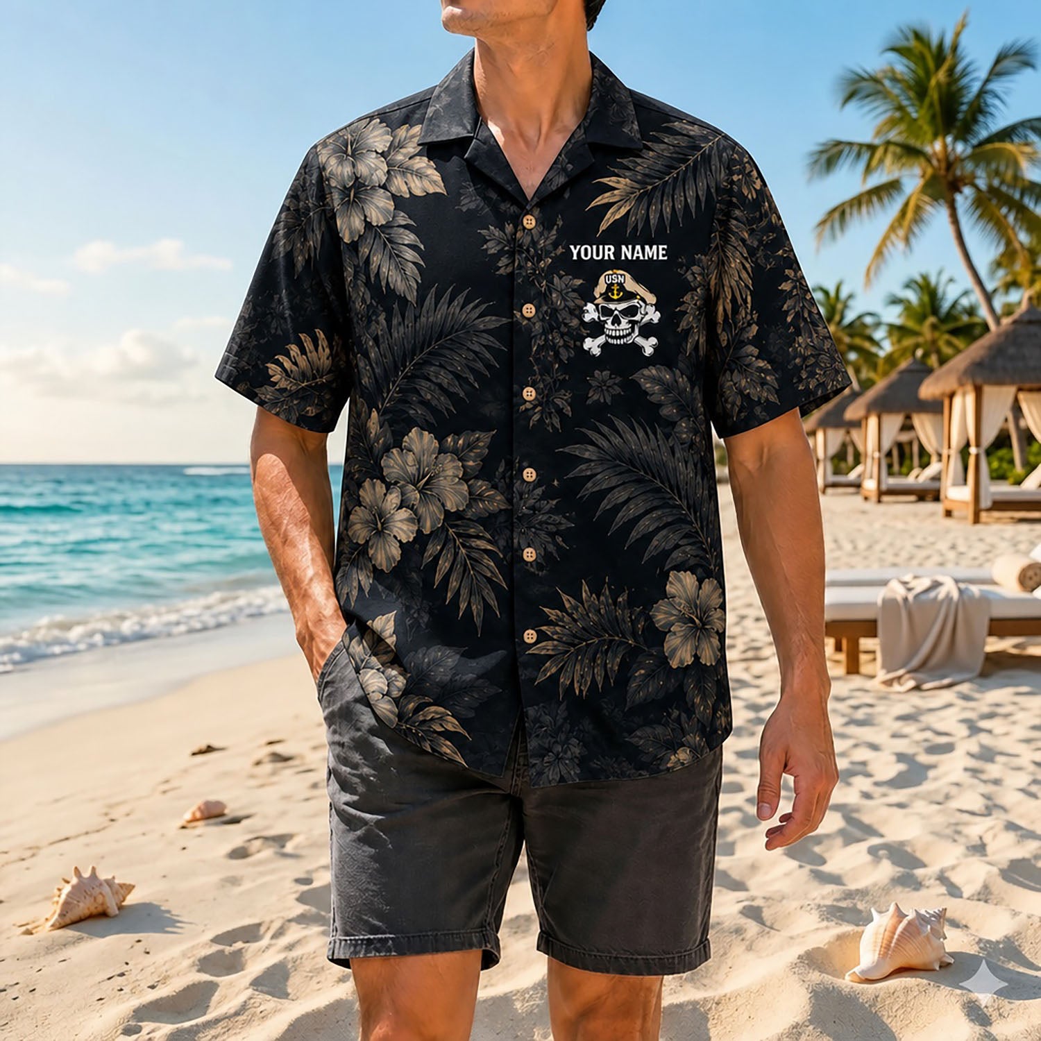 Full shot of a male model walking on the sand wearing the custom name navy chief skull shirt paired with casual dark grey shorts