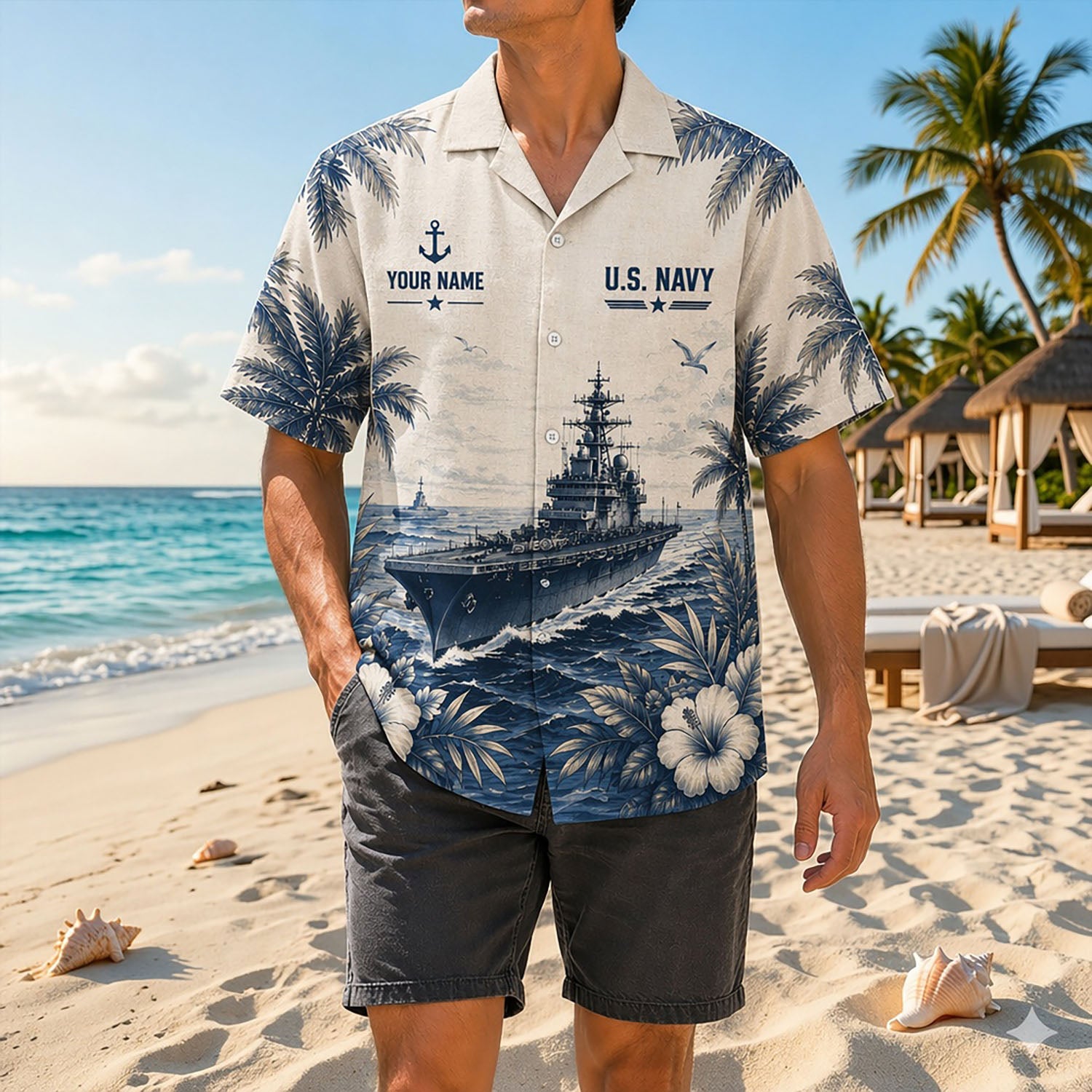 Full shot of a male model standing on sand wearing the custom name naval submarine shirt paired with dark grey casual shorts