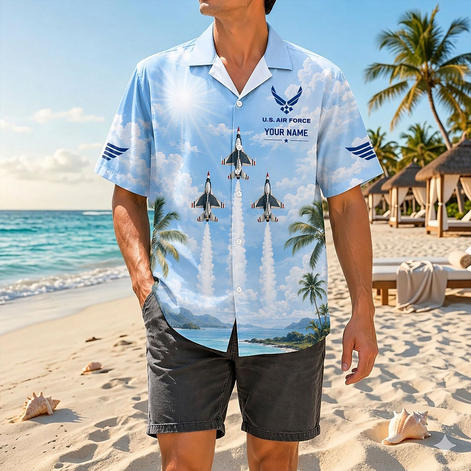 Full shot of a male model standing on a sunny beach wearing the custom name Thunderbirds and Su-57 jet shirt with dark casual shorts