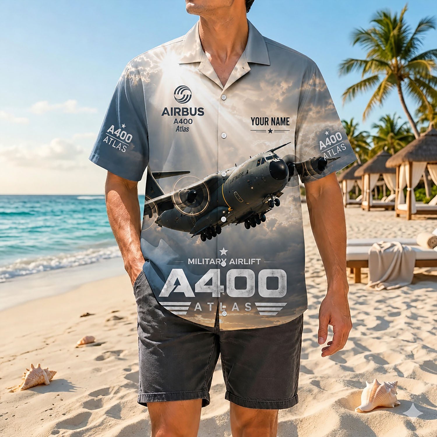 Full shot of a male model standing on a sunny coast wearing the custom name Airbus A400M aviation shirt paired with dark casual shorts