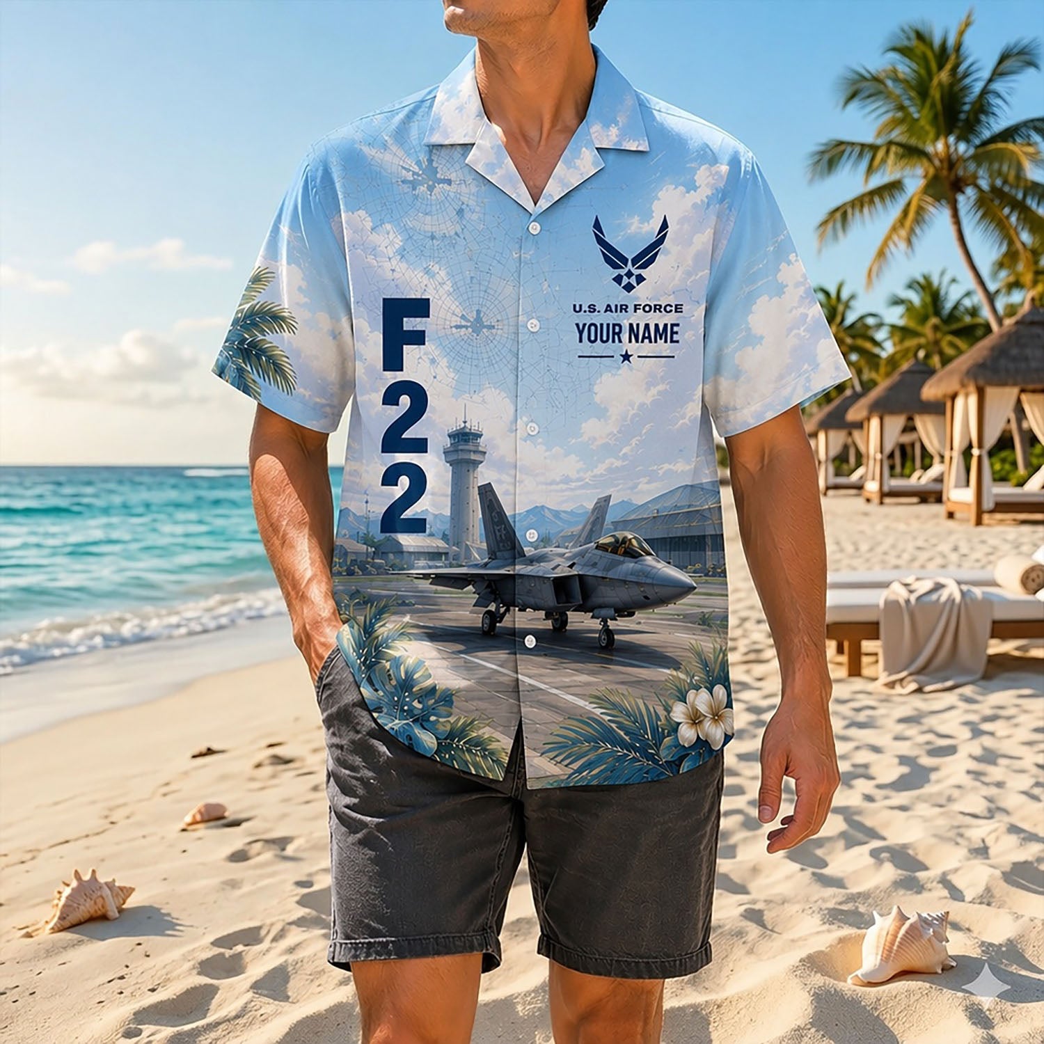 Full-body shot of a man modeling the custom military aviator shirt on a sunny shoreline paired with dark grey shorts