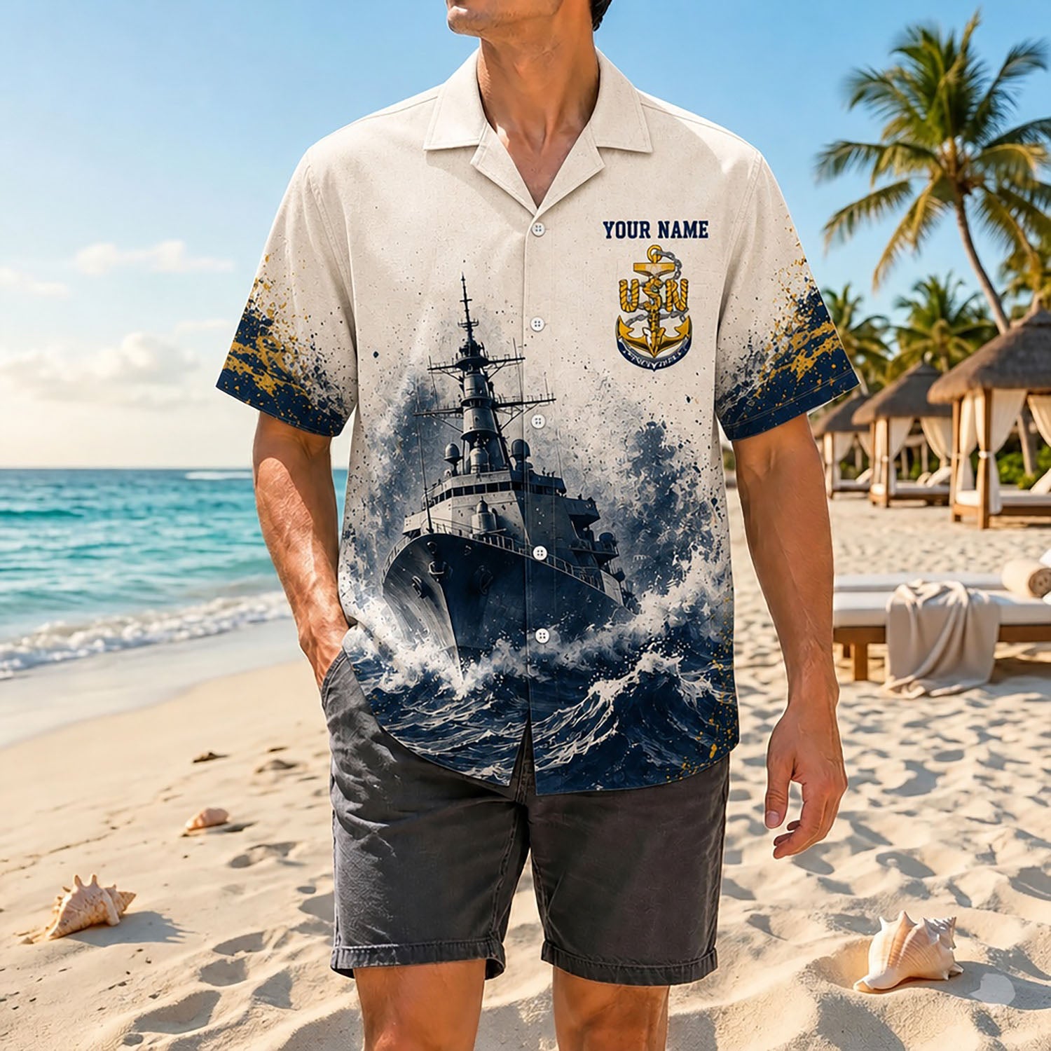 Full shot of a male model walking on the sand wearing the custom name Navy Chief warship veteran shirt with dark charcoal shorts