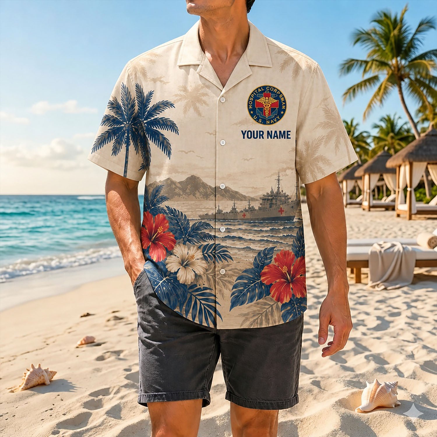 Full shot of a male model standing on a sunny beach wearing the custom name Navy Corpsman veteran shirt with casual black shorts