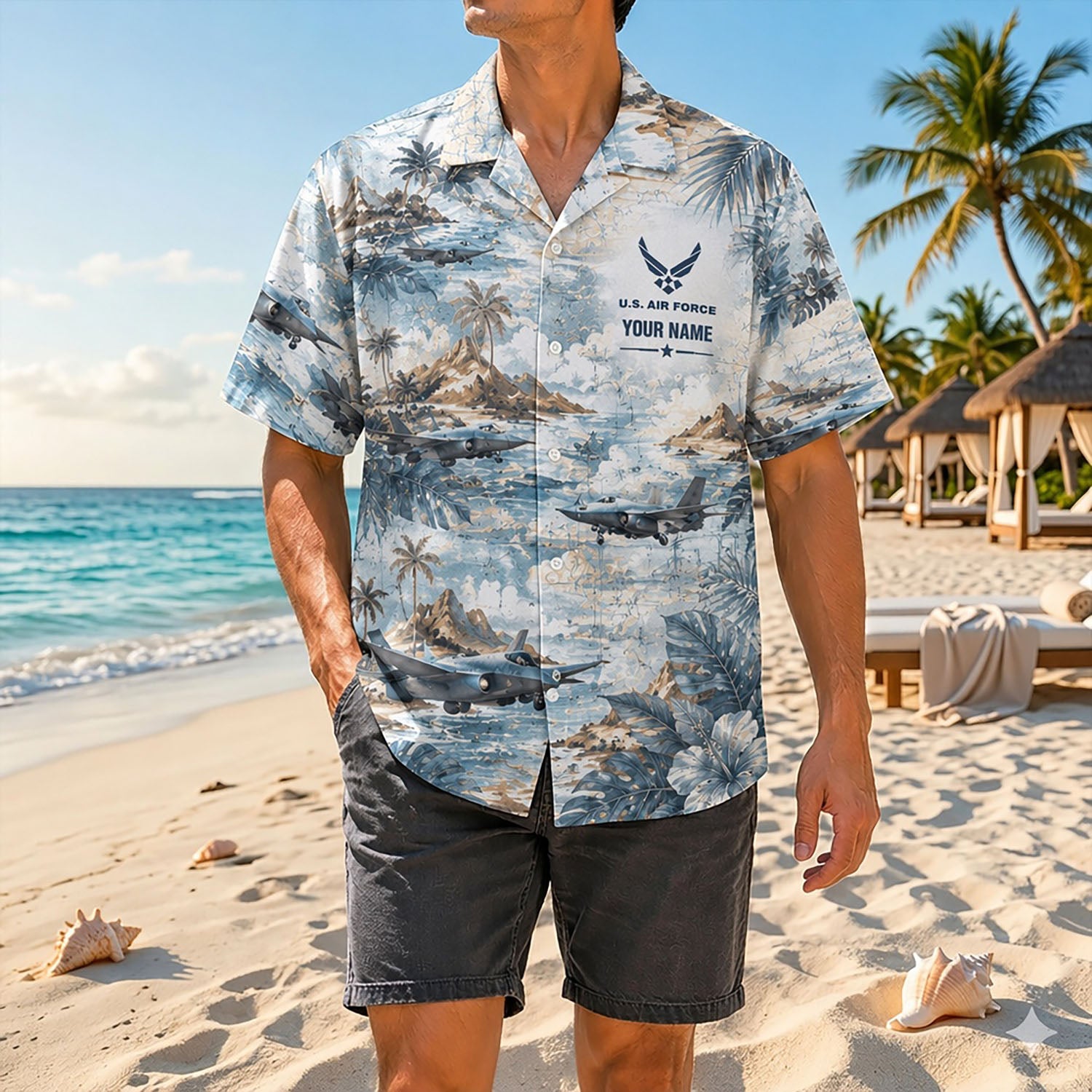 Full shot of a male model standing on a sunny coast wearing the custom name F-35 aviation shirt paired with dark casual shorts