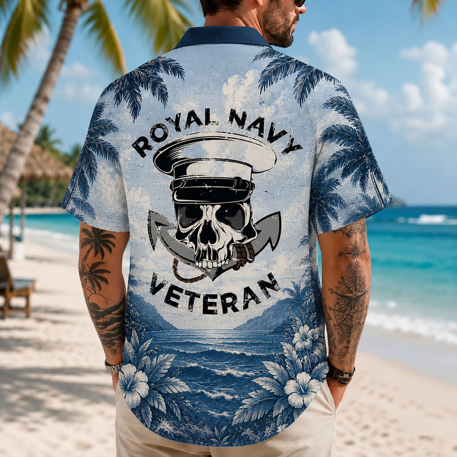 Back view lifestyle of a man on a beach wearing the custom veteran shirt showing the large Royal Navy Veteran skull and anchor print