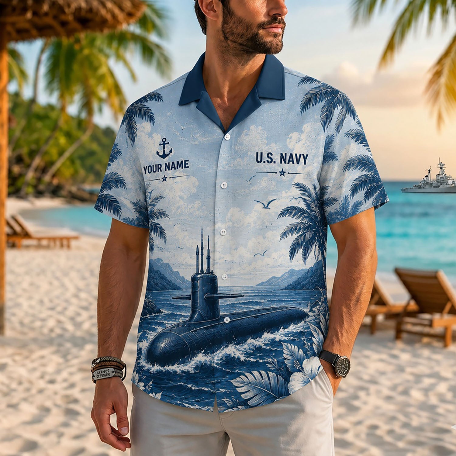 Close-up front view of a male model on a tropical beach wearing the personalized indigo blue US Navy submarine Hawaiian shirt