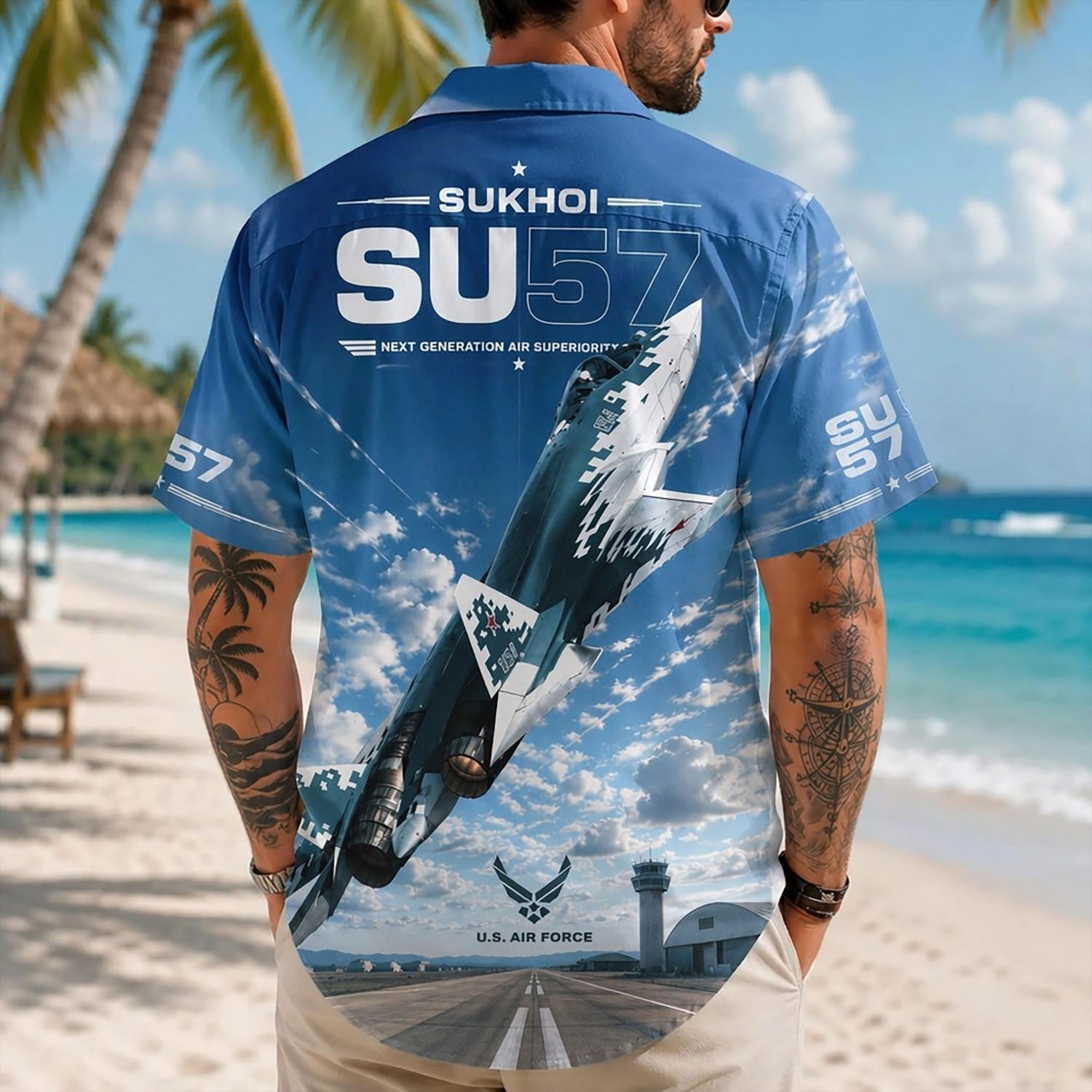 Back view lifestyle of a man showcasing the detailed digital camo stealth jet graphics and control tower base on a sunny beach background