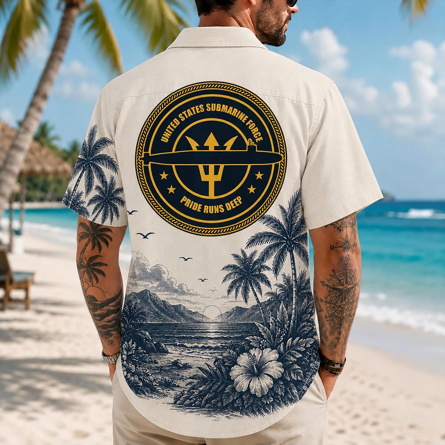 Back view lifestyle of a man showcasing the striking gold trident submarine force insignia over a scenic coastal sunset backing