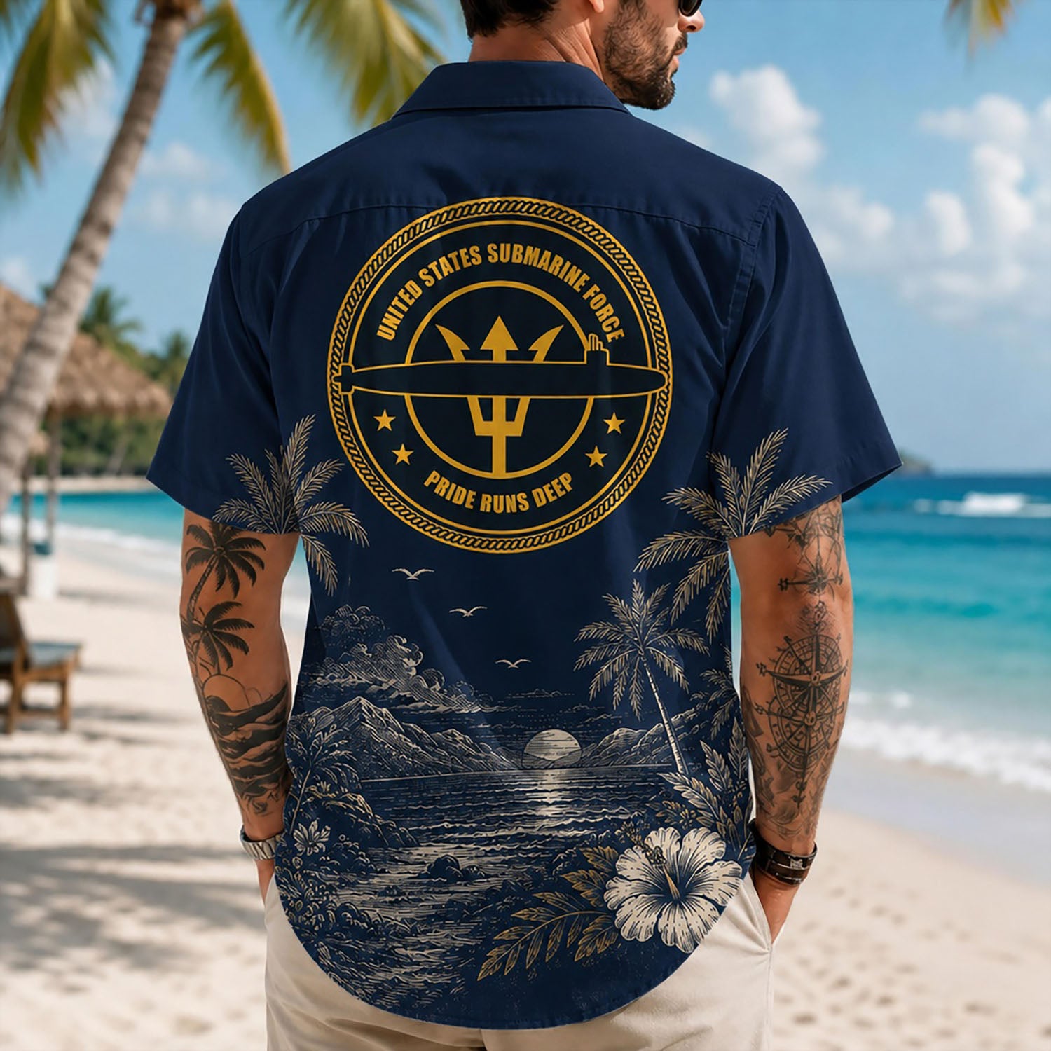 Back view lifestyle of a man showcasing the striking gold trident submarine force insignia over a scenic coastal ocean backing