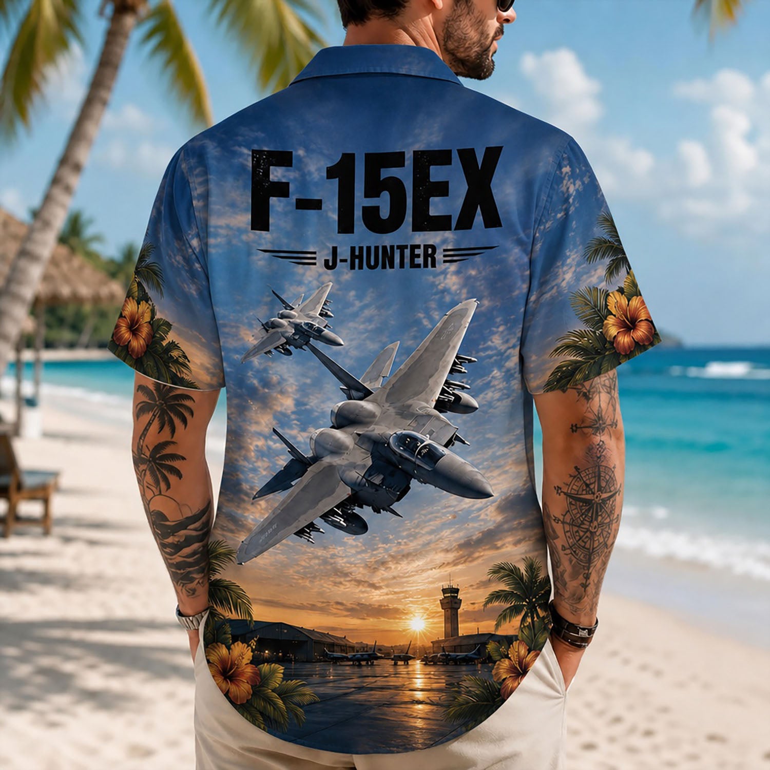 Back view lifestyle of a man showcasing the bold F-15EX jet graphics, airbase tower, and J-Hunter insignia on sand