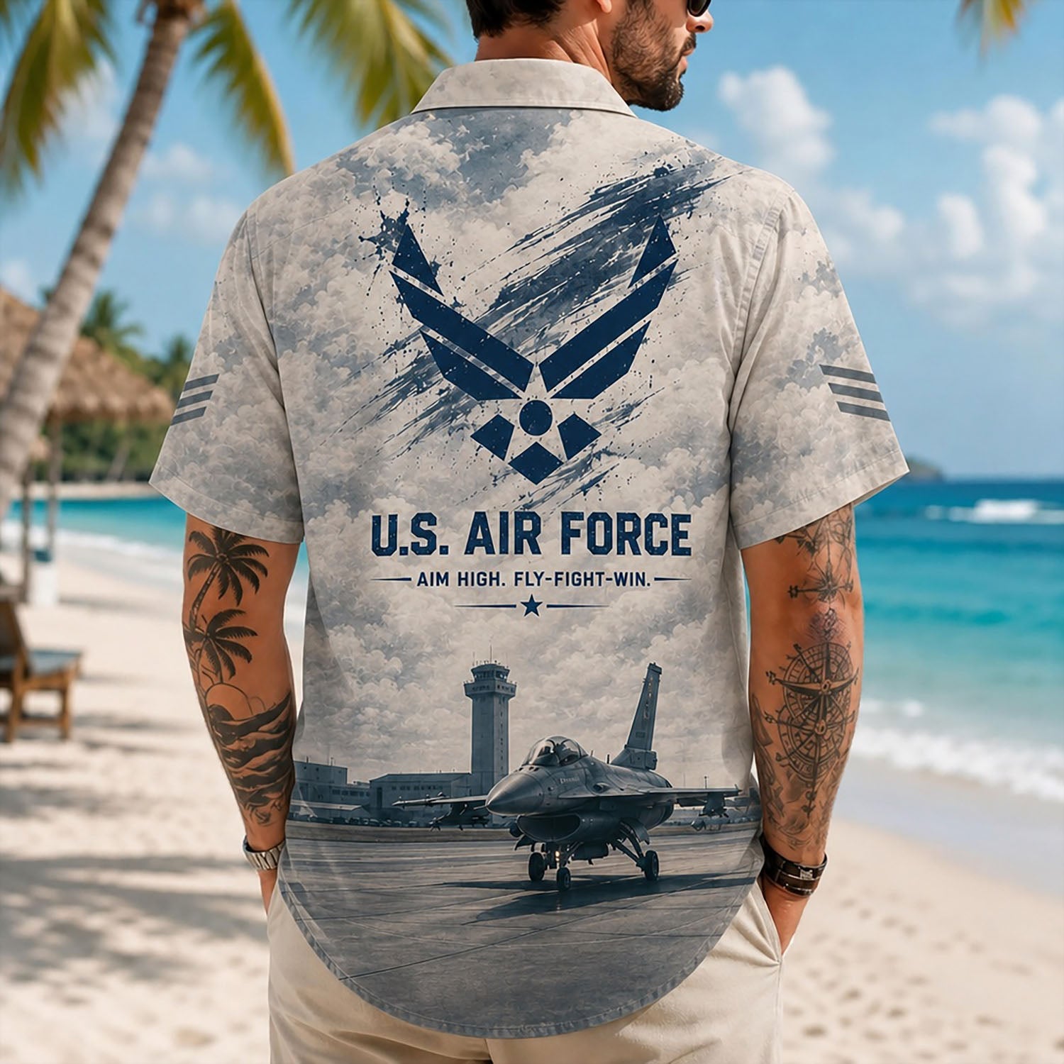 Back view lifestyle of a male model showcasing the technical airbase flight line layout, distressed textures, and bold military typography