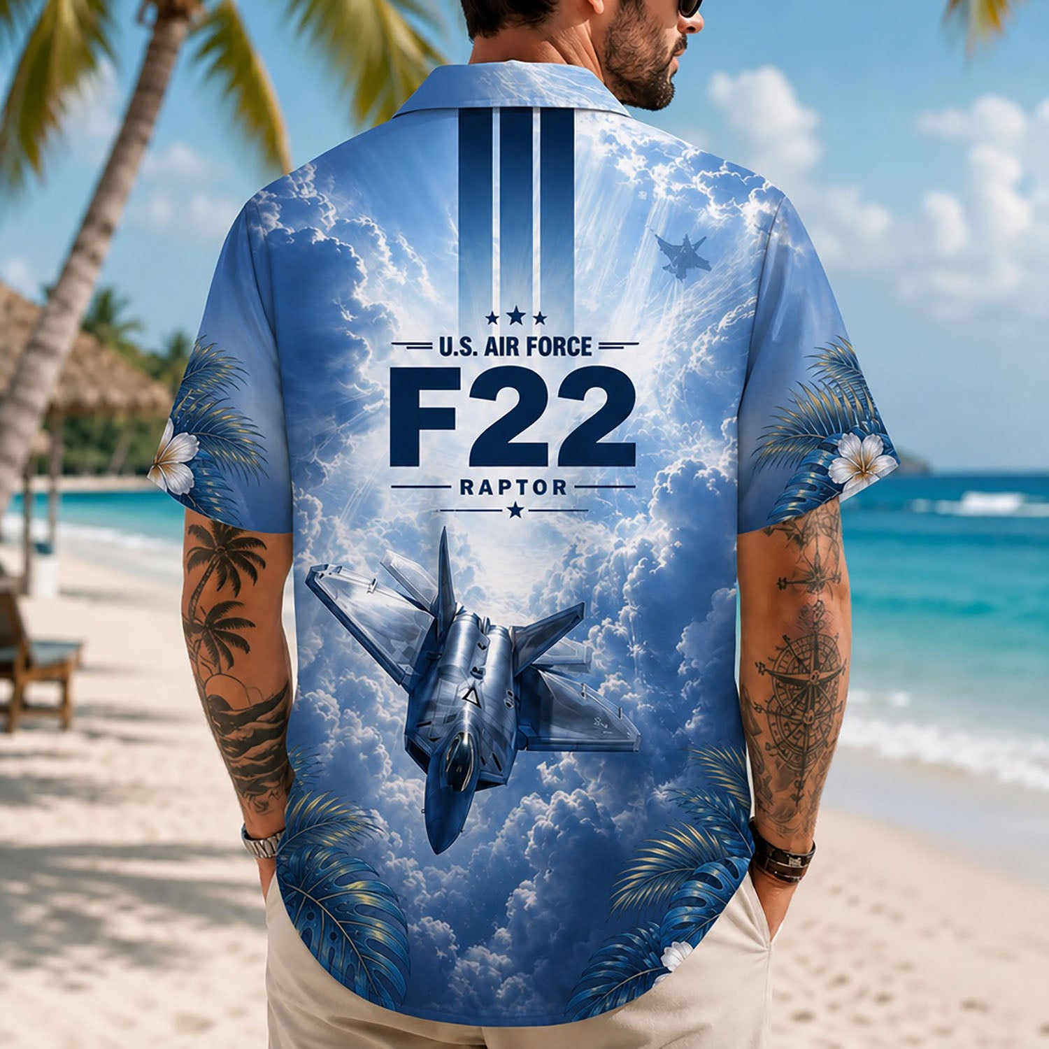 Back view lifestyle of a man showcasing the large iconic F-22 Raptor graphics and air military stripes on sand