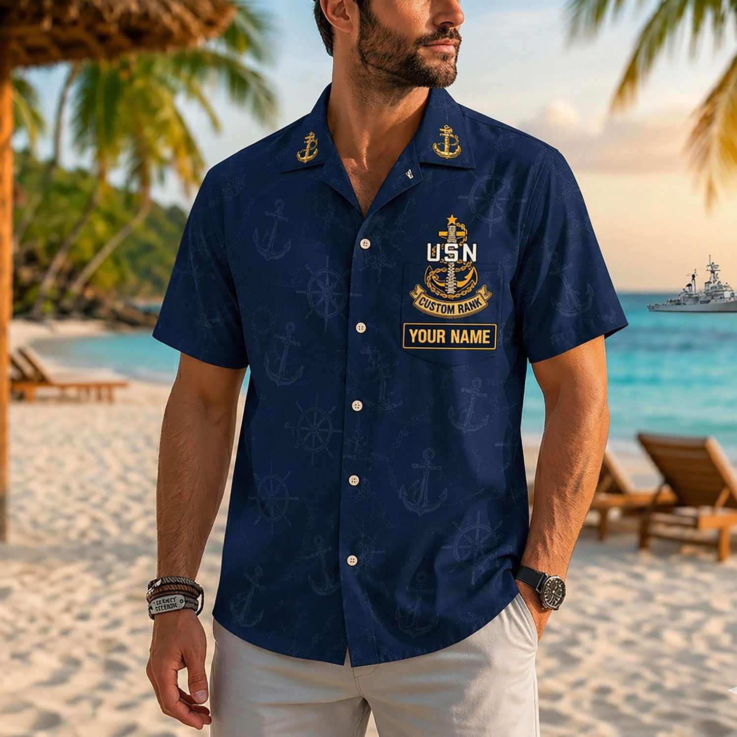 Close-up front view of a male model on a tropical beach wearing the personalized classic navy blue USN Chiefs Hawaiian shirt