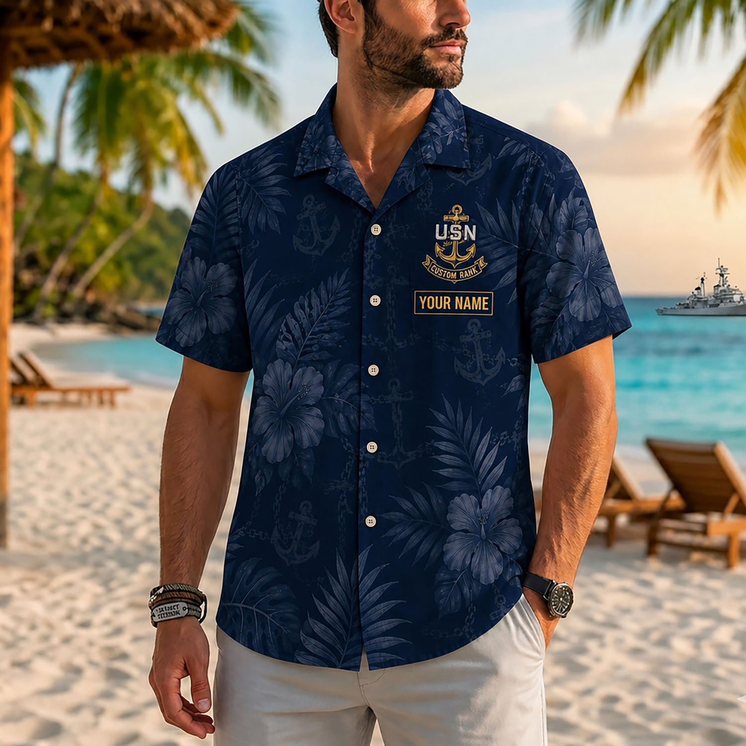 Close-up front view of a male model on a tropical beach wearing the personalized navy blue floral USN military shirt