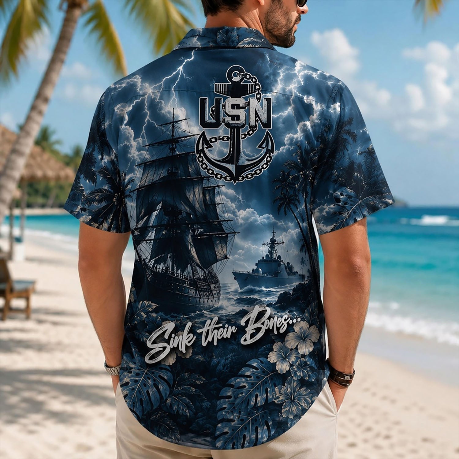 Back view lifestyle of a man showing the dramatic ocean tempest graphics, naval fleet artwork, and patriotic military quote typography
