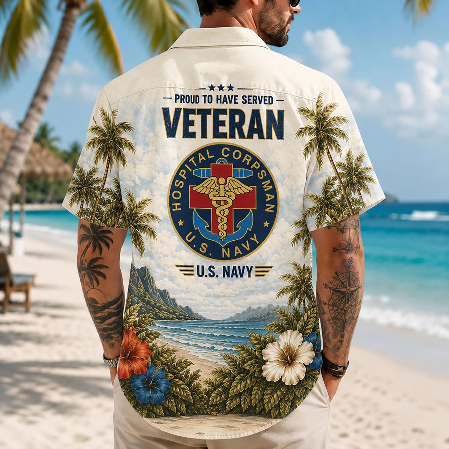 Back view lifestyle of a man standing on the sand displaying the colorful coastal scenery and bold USN Corpsman emblem print