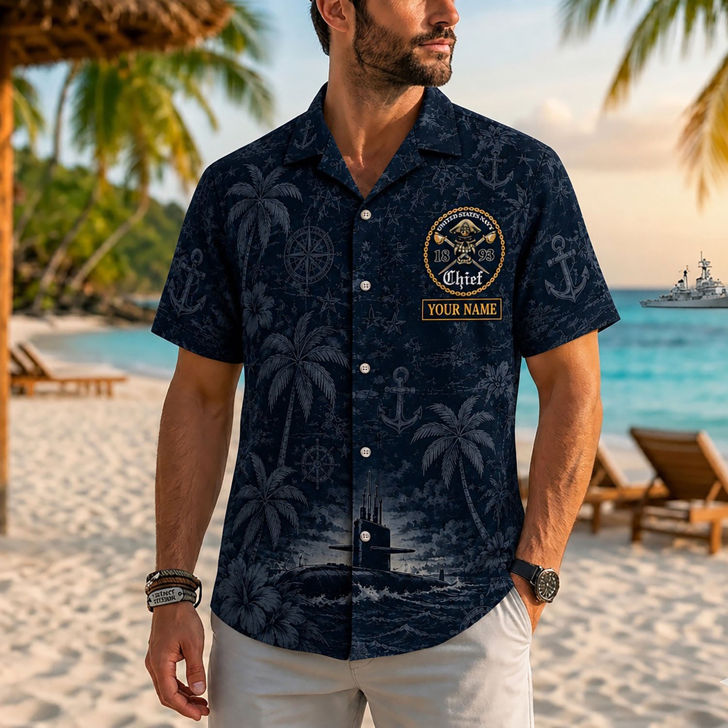 Close-up front view of a male model on a tropical beach wearing the custom dark blue Navy Submarine Chief personalized shirt