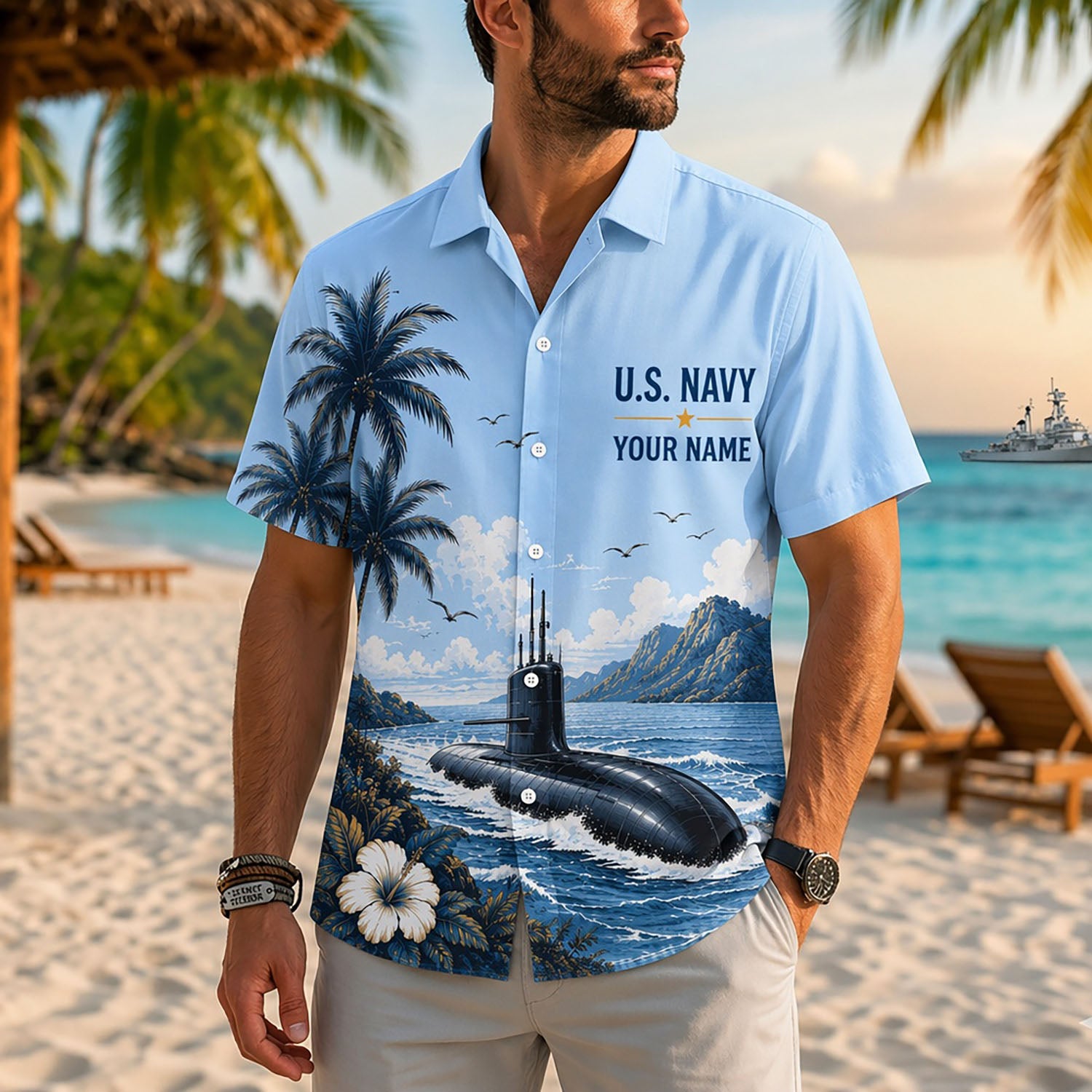 Close-up front view of a male model standing on a tropical beach wearing the personalized light blue US Navy submarine military Hawaiian shirt