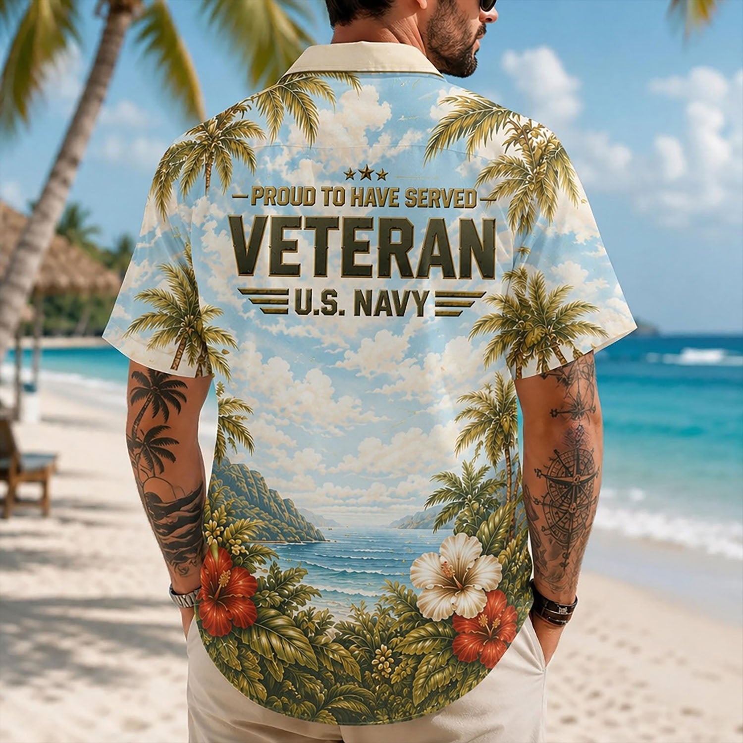 Back view lifestyle of a man standing on the sand displaying the colorful coastal paradise scene and bold US Navy veteran tribute print